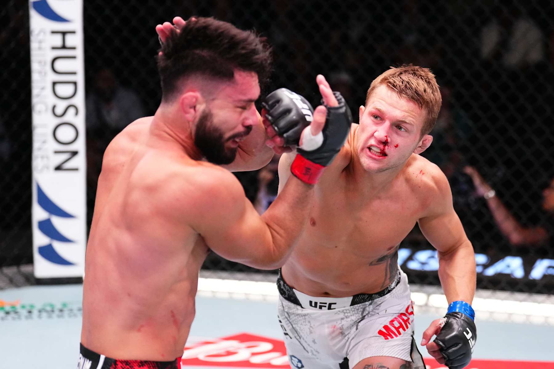LAS VEGAS, NEVADA - AUGUST 24: (R-L) Francis Marshall punches Dennis Buzukja in a featherweight fight during the UFC Fight Night event at UFC APEX on August 24, 2024 in Las Vegas, Nevada. (Photo by Chris Unger/Zuffa LLC)