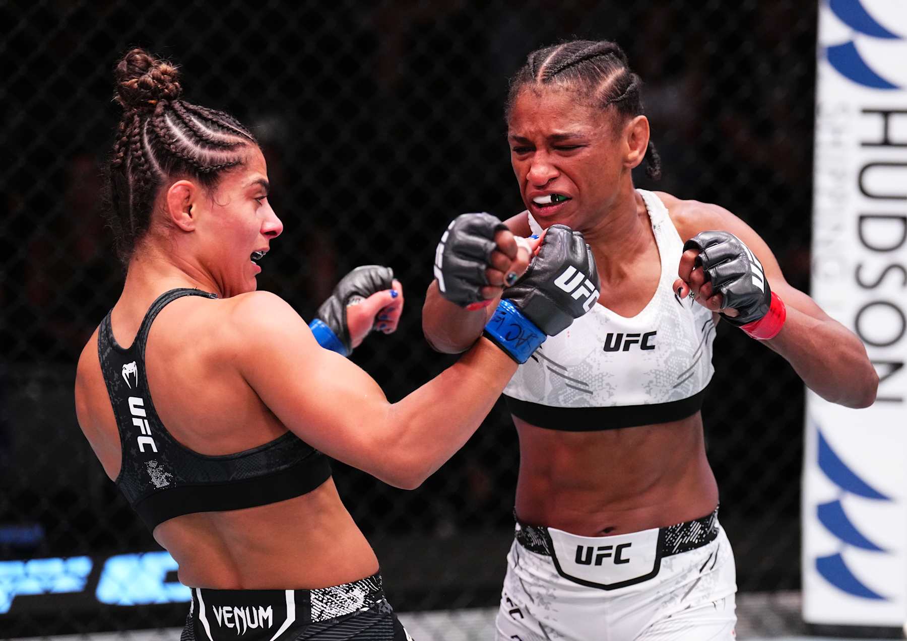 LAS VEGAS, NEVADA - AUGUST 24: (R-L) Angela Hill punches Tabatha Ricci of Brazil in a strawweight fight during the UFC Fight Night event at UFC APEX on August 24, 2024 in Las Vegas, Nevada. (Photo by Chris Unger/Zuffa LLC)