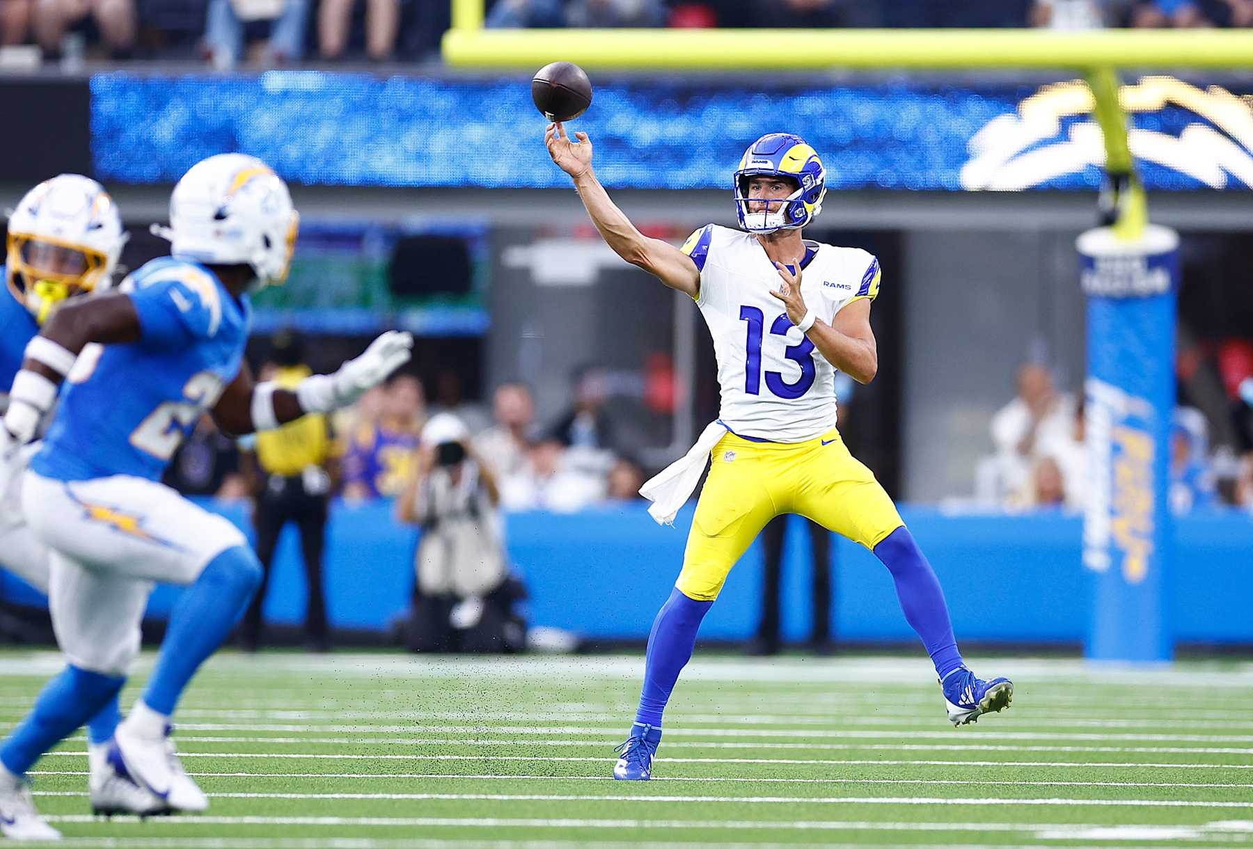 INGLEWOOD, CALIFORNIA - AUGUST 17:  Stetson Bennett #13 of the Los Angeles Rams throws against the Los Angeles Chargers in the second half of a preseason game at SoFi Stadium on August 17, 2024 in Inglewood, California.  (Photo by Ronald Martinez/Getty Images)