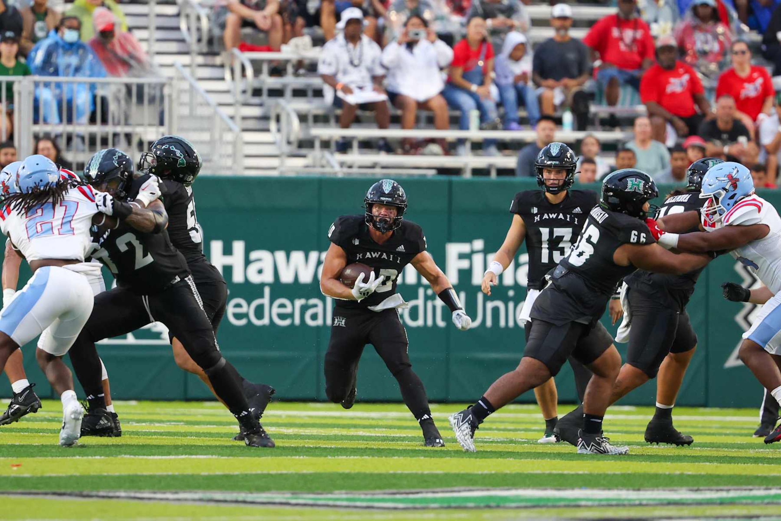 HONOLULU, HI - AUGUST 24: David Cordero #10 of the Hawaii Rainbow Warriors runs the ball during the first half of the game against the Delaware State Hornets at the Clarence T.C. Ching Athletics Complex on August 24, 2024 in Honolulu, Hawaii. (Photo by Darryl Oumi/Getty Images)