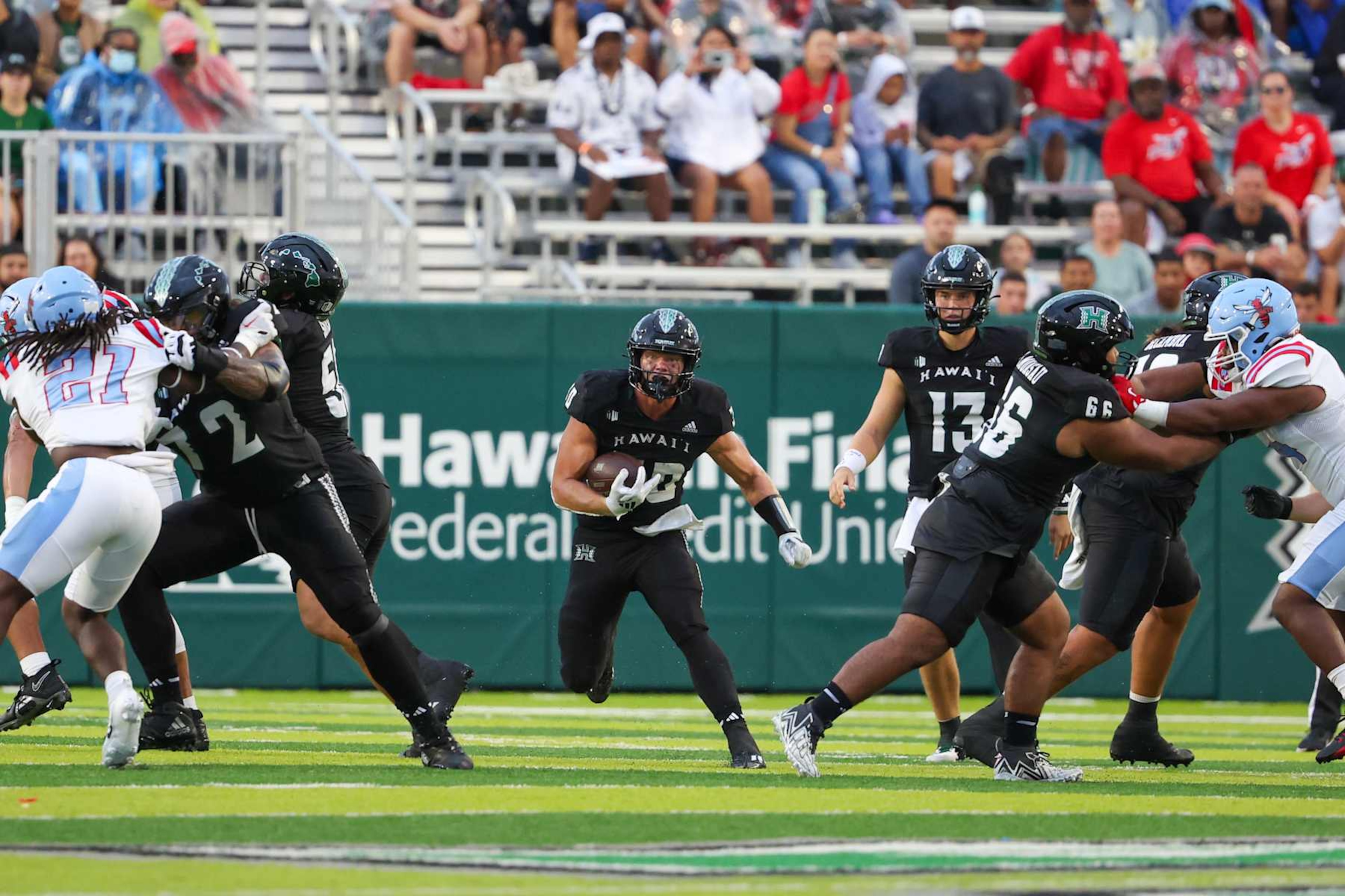 HONOLULU, HI - AUGUST 24: David Cordero #10 of the Hawaii Rainbow Warriors runs the ball during the first half of the game against the Delaware State Hornets at the Clarence T.C. Ching Athletics Complex on August 24, 2024 in Honolulu, Hawaii. (Photo by Darryl Oumi/Getty Images)