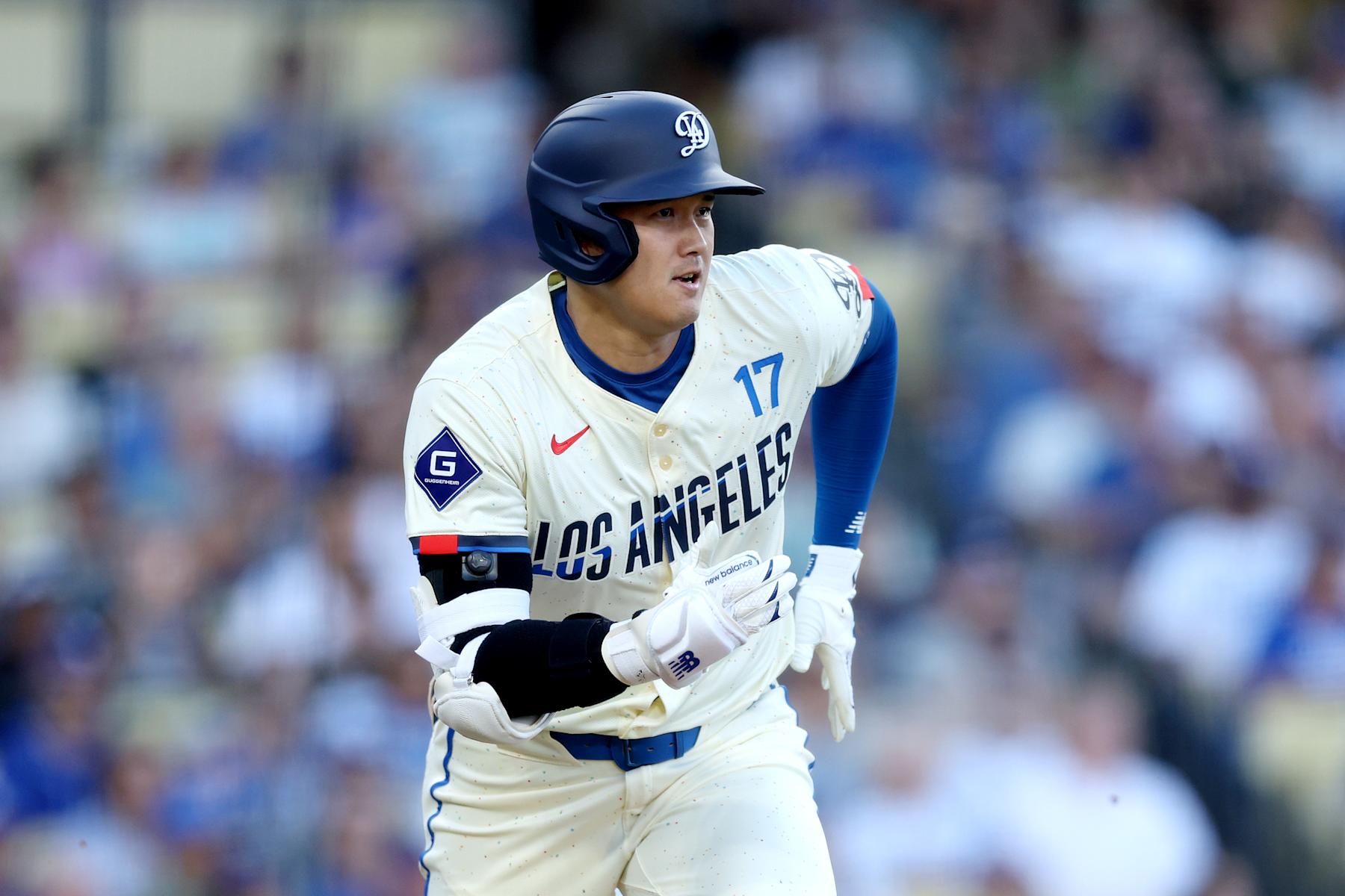LOS ANGELES, CALIFORNIA - AUGUST 24: Shohei Ohtani #17 of the Los Angeles Dodgers runs to first base during the first inning against the Tampa Bay Rays at Dodger Stadium on August 24, 2024 in Los Angeles, California. (Photo by Katelyn Mulcahy/Getty Images)