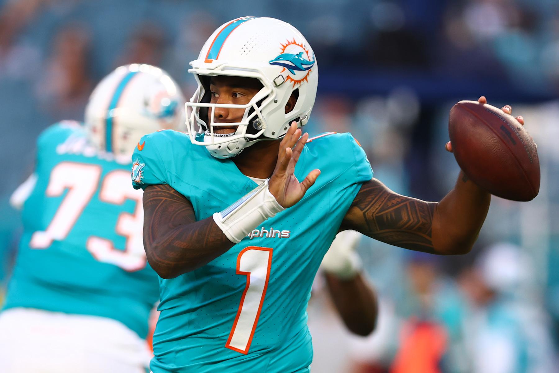 MIAMI GARDENS, FLORIDA - AUGUST 17: Tua Tagovailoa #1 of the Miami Dolphins throws a pass against the Washington Commanders during the first quarter of a preseason game at Hard Rock Stadium on August 17, 2024 in Miami Gardens, Florida. (Photo by Megan Briggs/Getty Images)