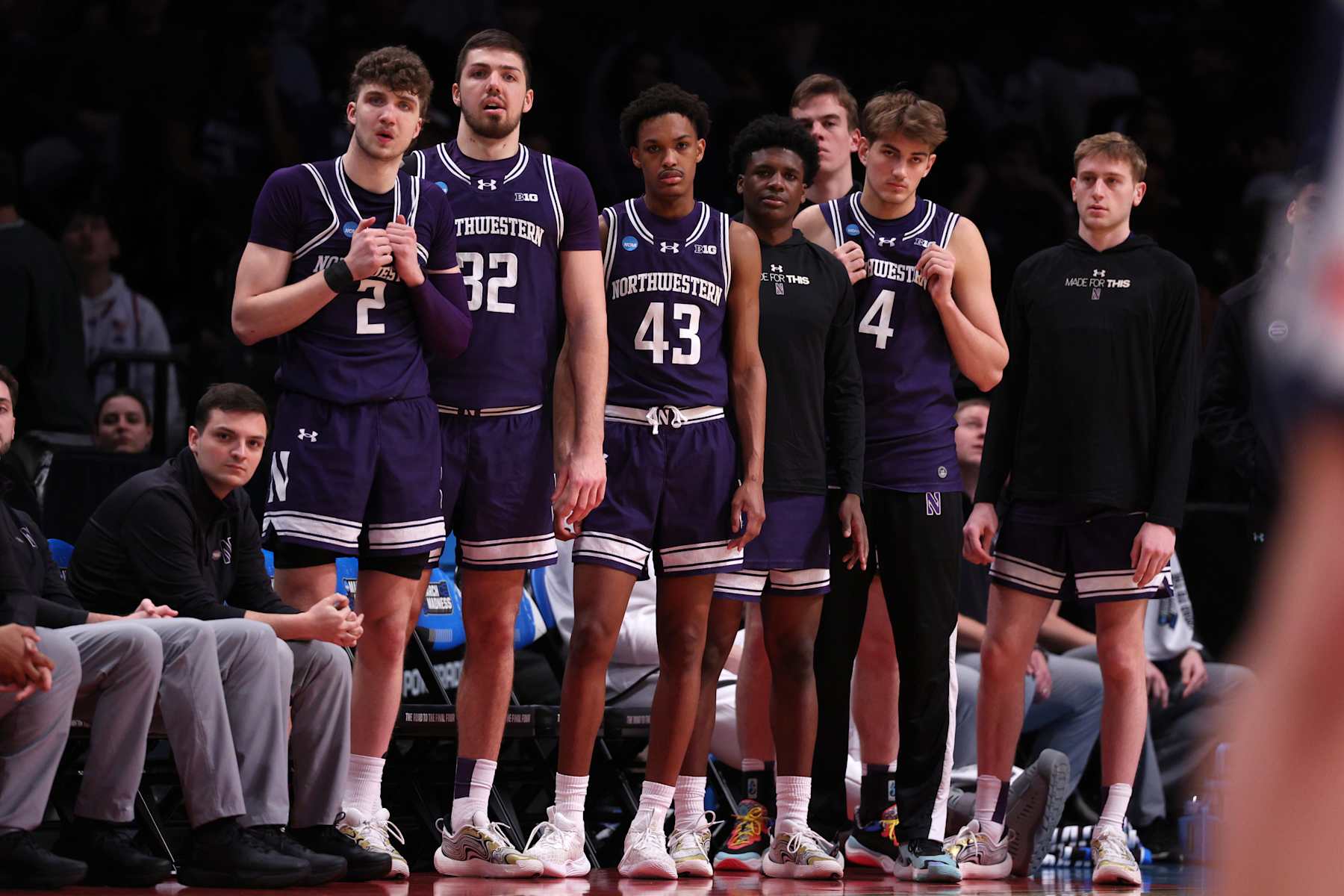 NEW YORK, NEW YORK - MARCH 24: Players react on the Northwestern Wildcats bench during the second half against the Connecticut Huskies in the second round of the NCAA Men's Basketball Tournament at Barclays Center on March 24, 2024 in New York City. (Photo by Elsa/Getty Images)