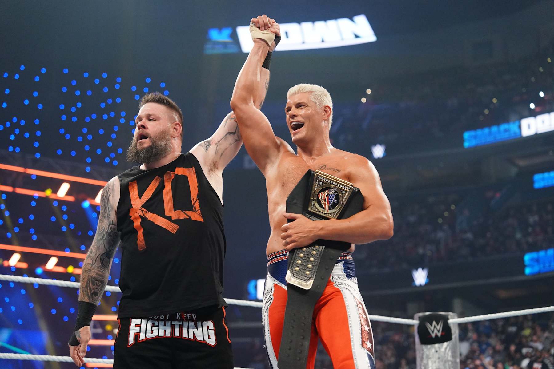 WASHINGTON, DC - AUGUST 23: Kevin Owens and Undisputed Champion Cody Rhodes celebrate after their match during SmackDown at Capital One Arena on August 23, 2024 in Washington, DC.  (Photo by WWE/Getty Images)