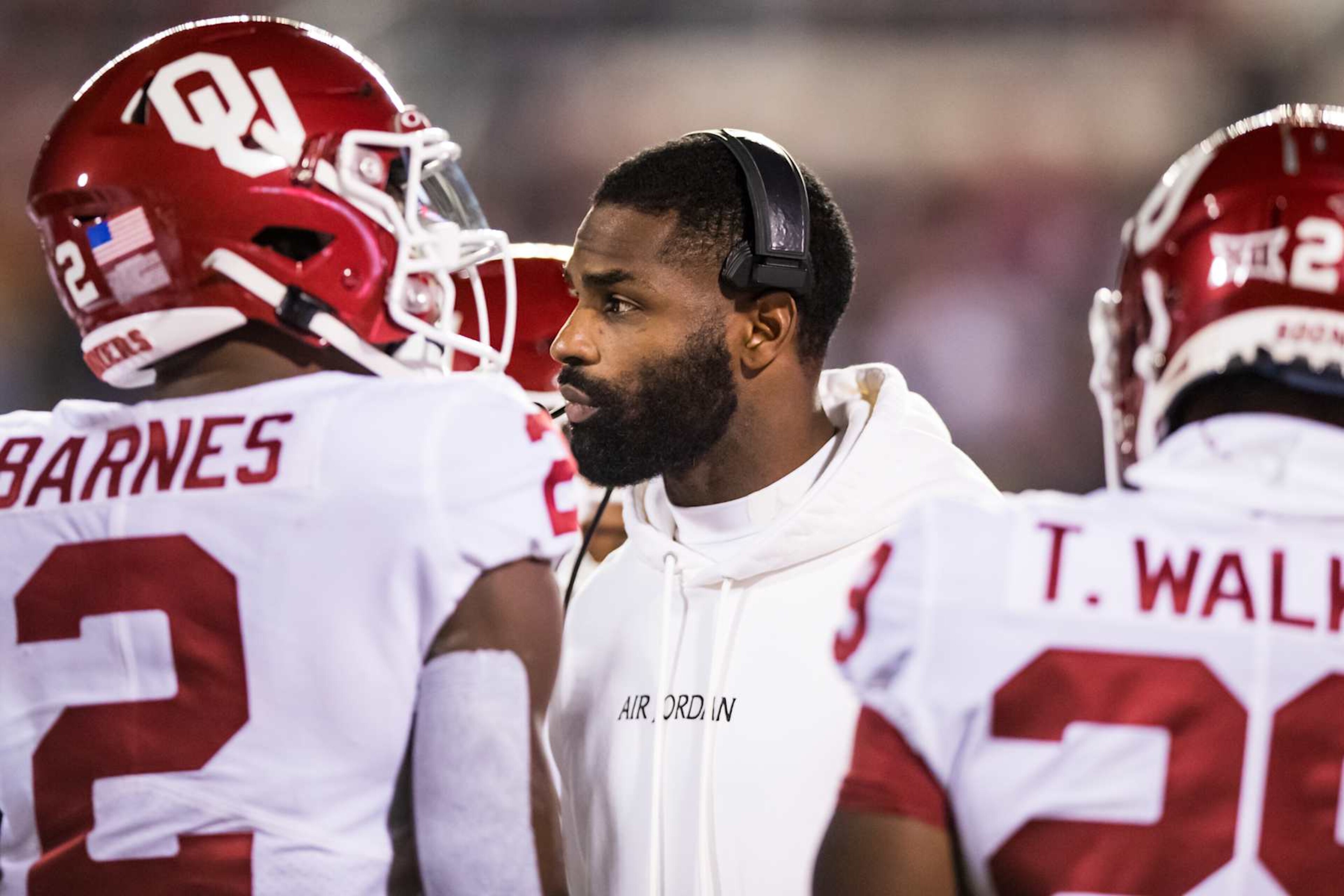 LUBBOCK, TEXAS - NOVEMBER 26: Running backs coach DeMarco Murray of the Oklahoma Sooners stands on the field during a timeout during the first half against the Texas Tech Red Raiders at Jones AT&T Stadium on November 26, 2022 in Lubbock, Texas. (Photo by John E. Moore III/Getty Images) LUBBOCK, TEXAS - NOVEMBER 26: Running backs coach DeMarco Murray of the Oklahoma Sooners stands on the field during a timeout during the first half against the Texas Tech Red Raiders at Jones AT&T Stadium on November 26, 2022 in Lubbock, Texas. (Photo by John E. Moore III/Getty Images)