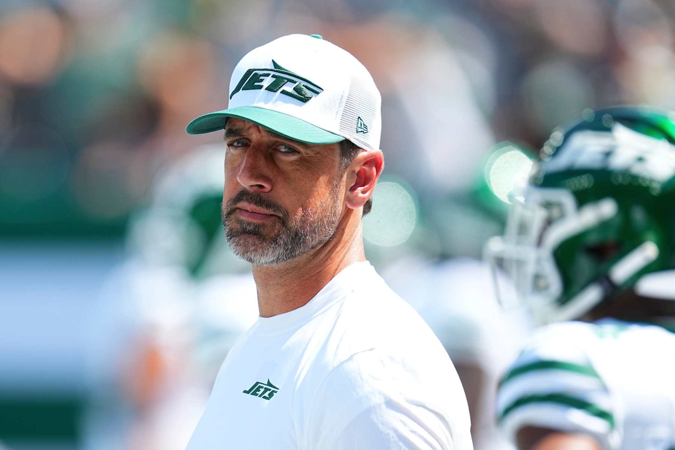 EAST RUTHERFORD, NEW JERSEY - AUGUST 10: Aaron Rodgers #8 of the New York Jets looks on prior to the preseason game against the Washington Commanders at MetLife Stadium on August 10, 2024 in East Rutherford, New Jersey. (Photo by Mitchell Leff/Getty Images) EAST RUTHERFORD, NEW JERSEY - AUGUST 10: Aaron Rodgers #8 of the New York Jets looks on prior to the preseason game against the Washington Commanders at MetLife Stadium on August 10, 2024 in East Rutherford, New Jersey. (Photo by Mitchell Leff/Getty Images)