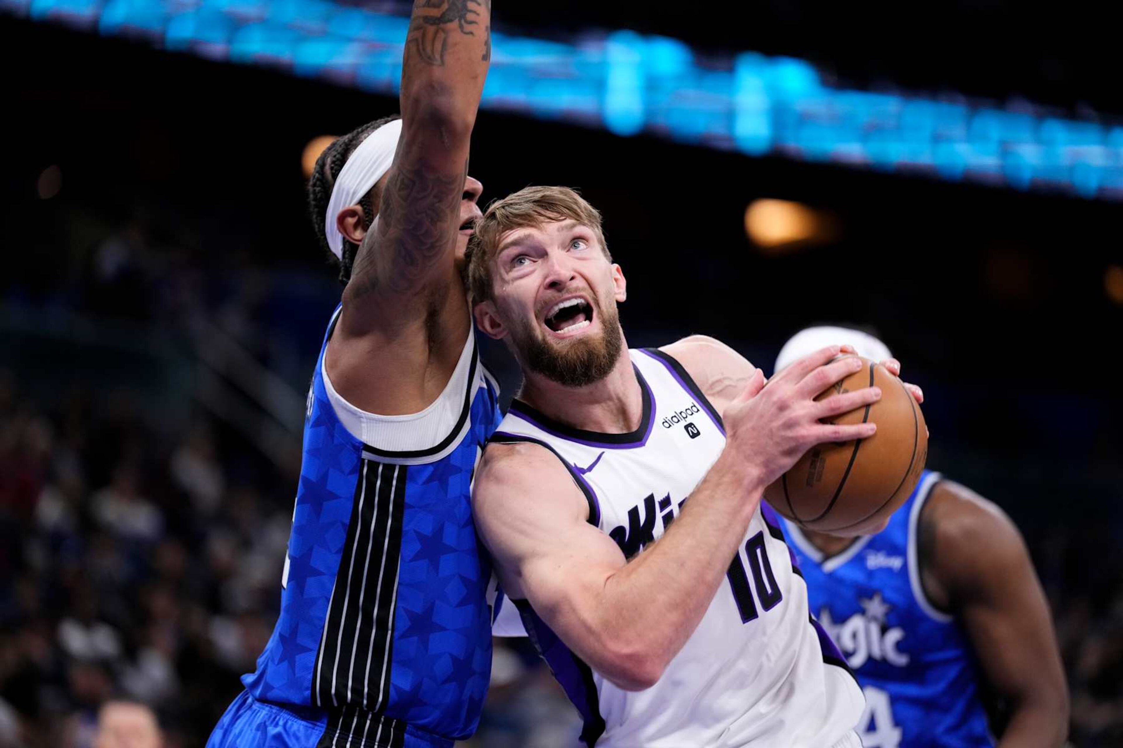ORLANDO, FLORIDA - MARCH 23: Domantas Sabonis #10 of the Sacramento Kings drives to the basket against Paolo Banchero #5 of the Orlando Magic during the first quarter at Kia Center on March 23, 2024 in Orlando, Florida. NOTE TO USER: User expressly acknowledges and agrees that, by downloading and or using this photograph, User is consenting to the terms and conditions of the Getty Images License Agreement. (Photo by Rich Storry/Getty Images)