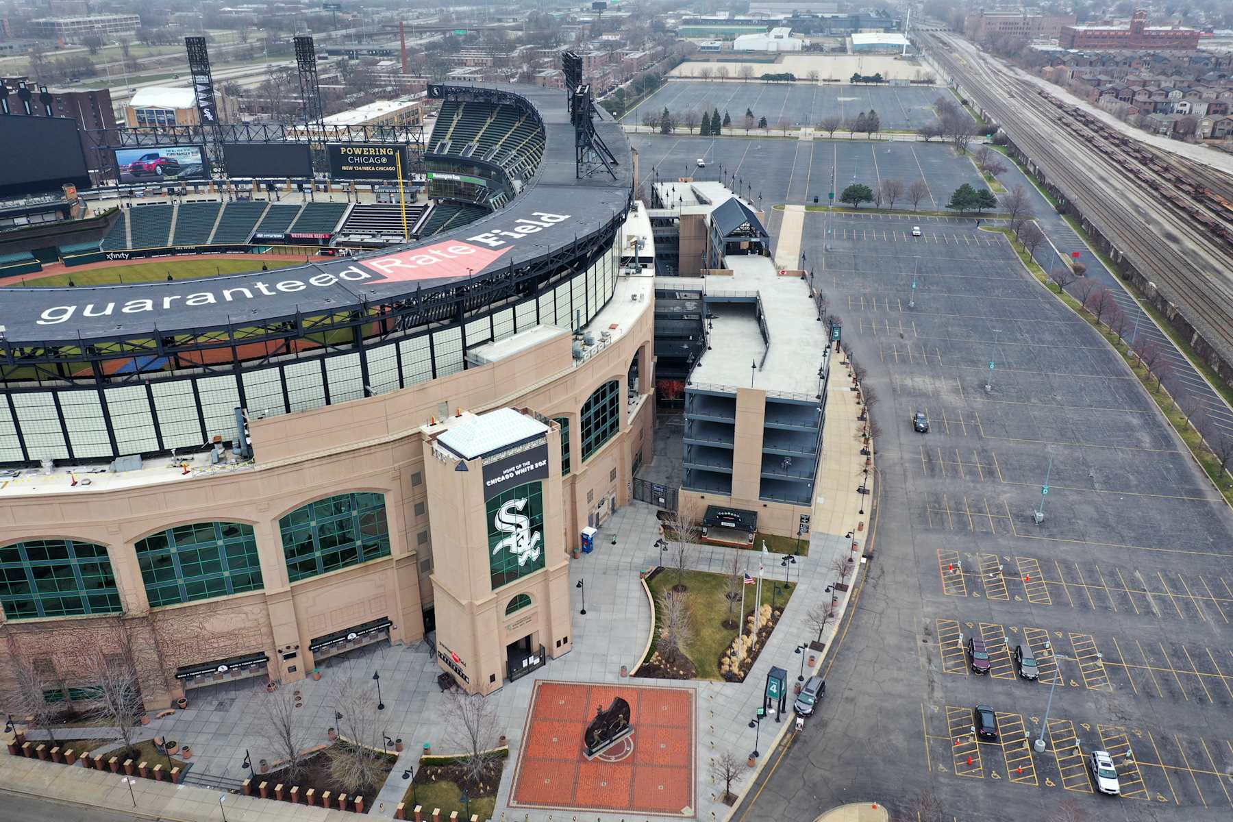 CHICAGO, ILLINOIS - MARCH 26: An aerial view from a drone shows Guaranteed Rate Field, home of the Chicago White Sox, which, like all Major League Baseball (MLB) parks sits nearly empty on what was to be opening day on March 26, 2020 in Chicago, Illinois. The White Sox were scheduled to host the Kansas City Royals at the park today. MLB has postponed the start of its season indefinitely due to the coronavirus (COVID-19) outbreak.  (Photo by Scott Olson/Getty Images)