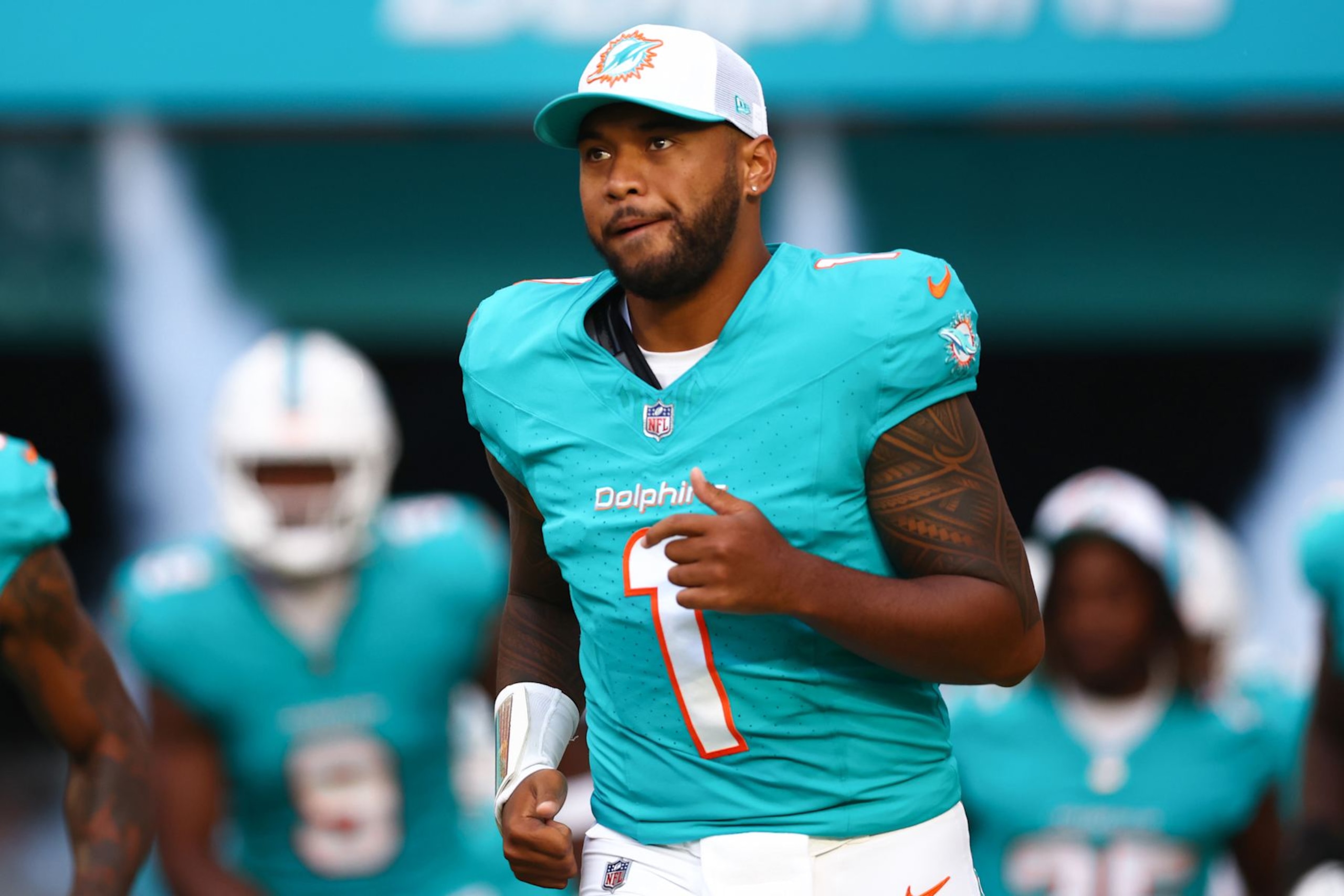MIAMI GARDENS, FLORIDA - AUGUST 17: Tua Tagovailoa #1 of the Miami Dolphins takes the field prior to a preseason game against the Washington Commanders at Hard Rock Stadium on August 17, 2024 in Miami Gardens, Florida. (Photo by Megan Briggs/Getty Images)