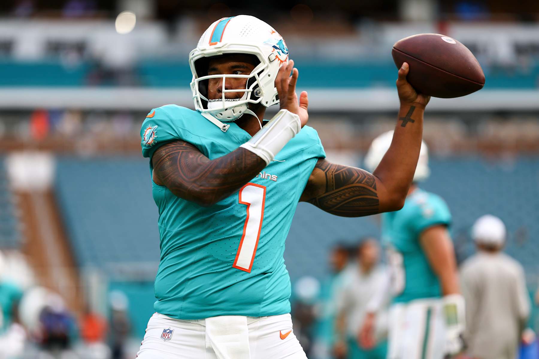 MIAMI GARDENS, FL - AUGUST 17: Tua Tagovailoa #1 of the Miami Dolphins warms up prior to an NFL preseason football game against the Washington Commanders at Hard Rock Stadium on August 17, 2024 in Miami Gardens, Florida. (Photo by Kevin Sabitus/Getty Images)