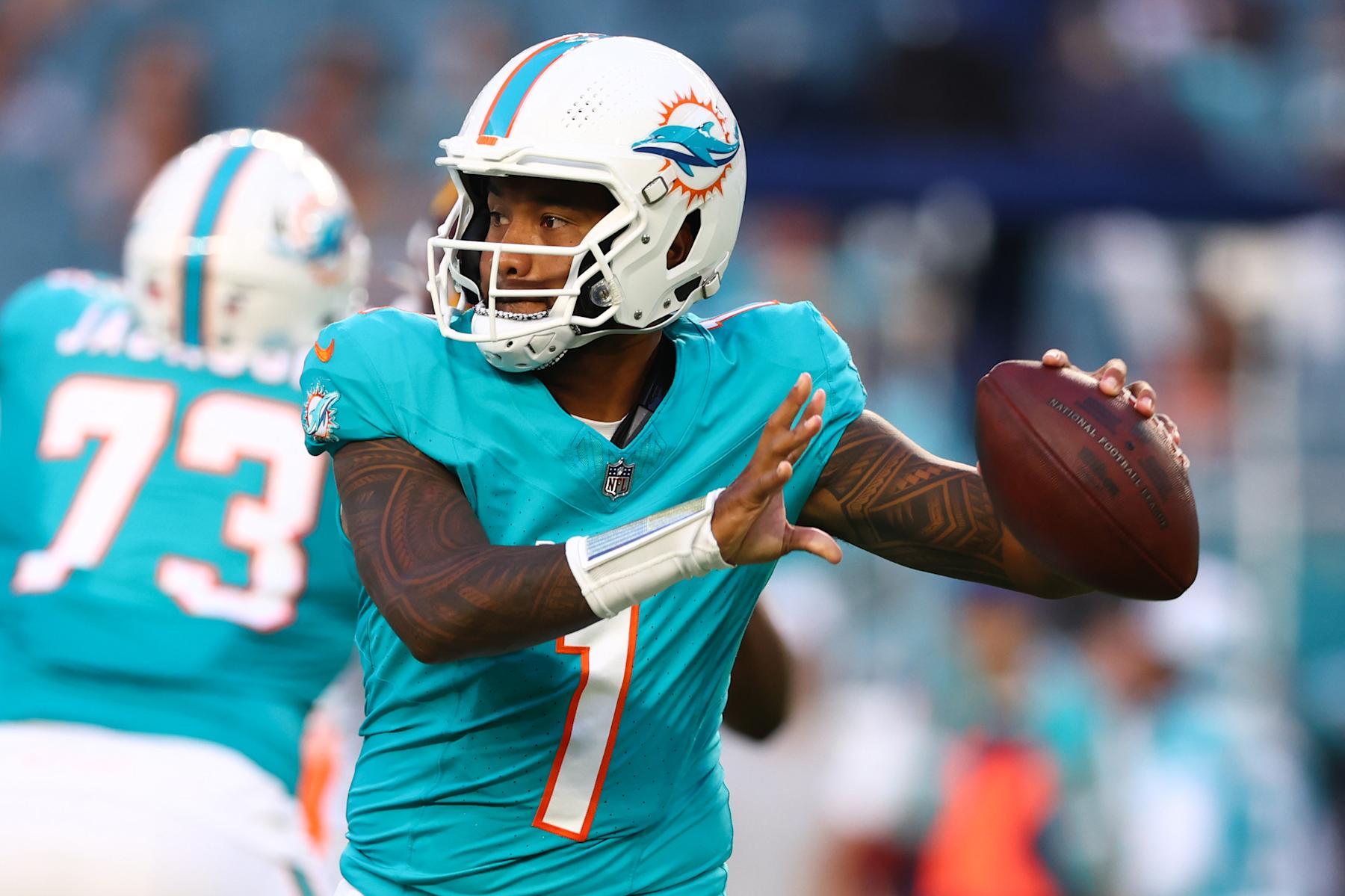 MIAMI GARDENS, FLORIDA - AUGUST 17: Tua Tagovailoa #1 of the Miami Dolphins throws a pass against the Washington Commanders during the first quarter of a preseason game at Hard Rock Stadium on August 17, 2024 in Miami Gardens, Florida. (Photo by Megan Briggs/Getty Images)