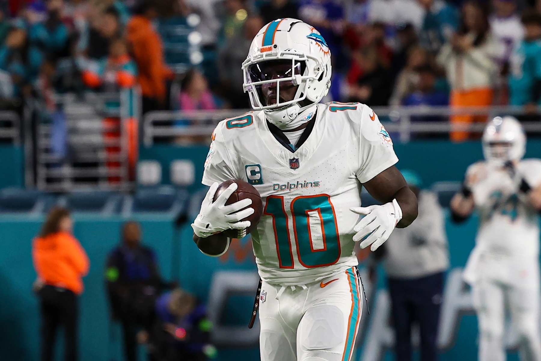 MIAMI GARDENS, FL - JANUARY 07: Tyreek Hill #10 of the Miami Dolphins warms up prior to an NFL football game against the Buffalo Bills at Hard Rock Stadium on January 7, 2024 in Miami Gardens, Florida. (Photo by Perry Knotts/Getty Images)
