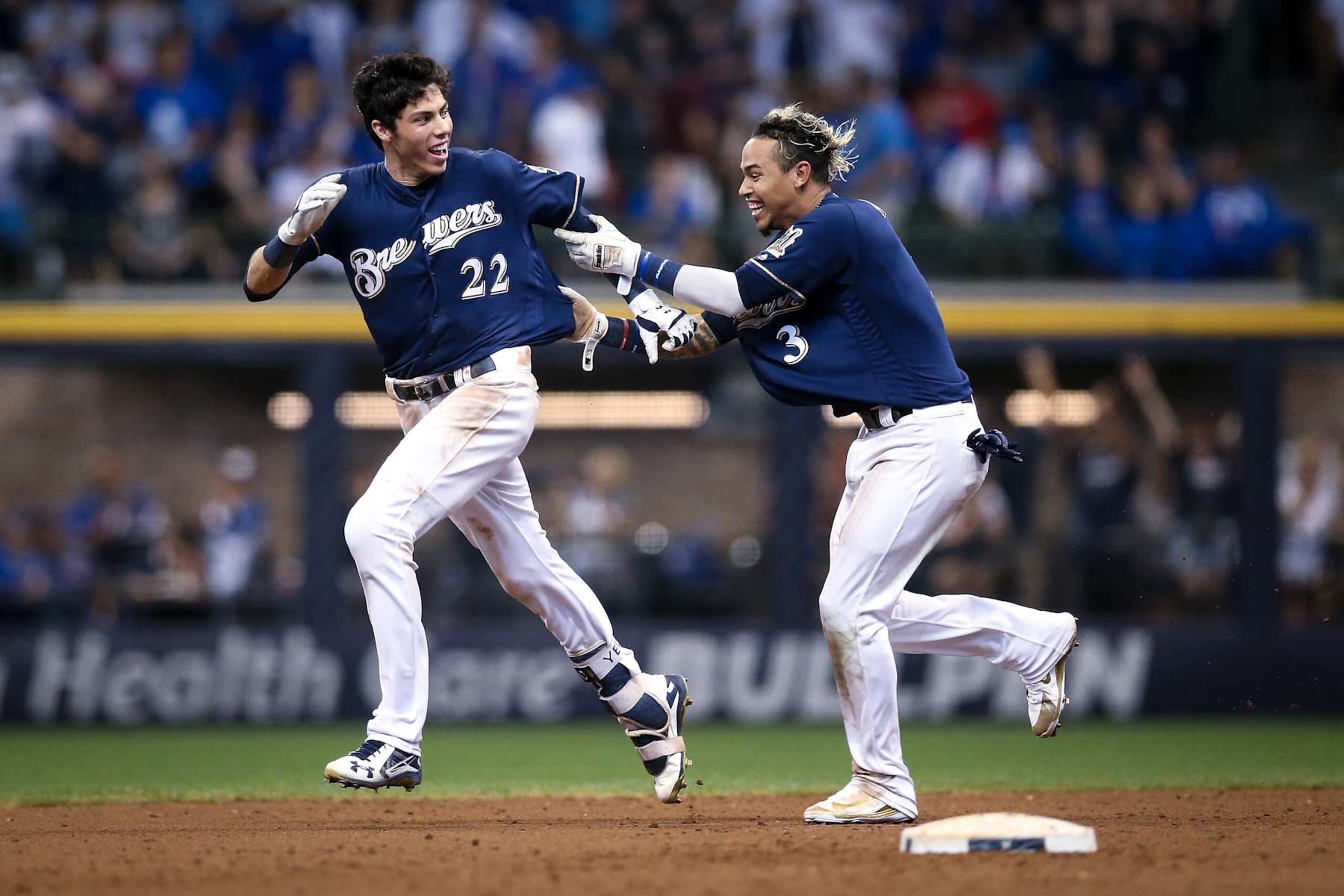 Christian Yelich (L) and Orlando Arcia (R) Christian Yelich (L) and Orlando Arcia (R)