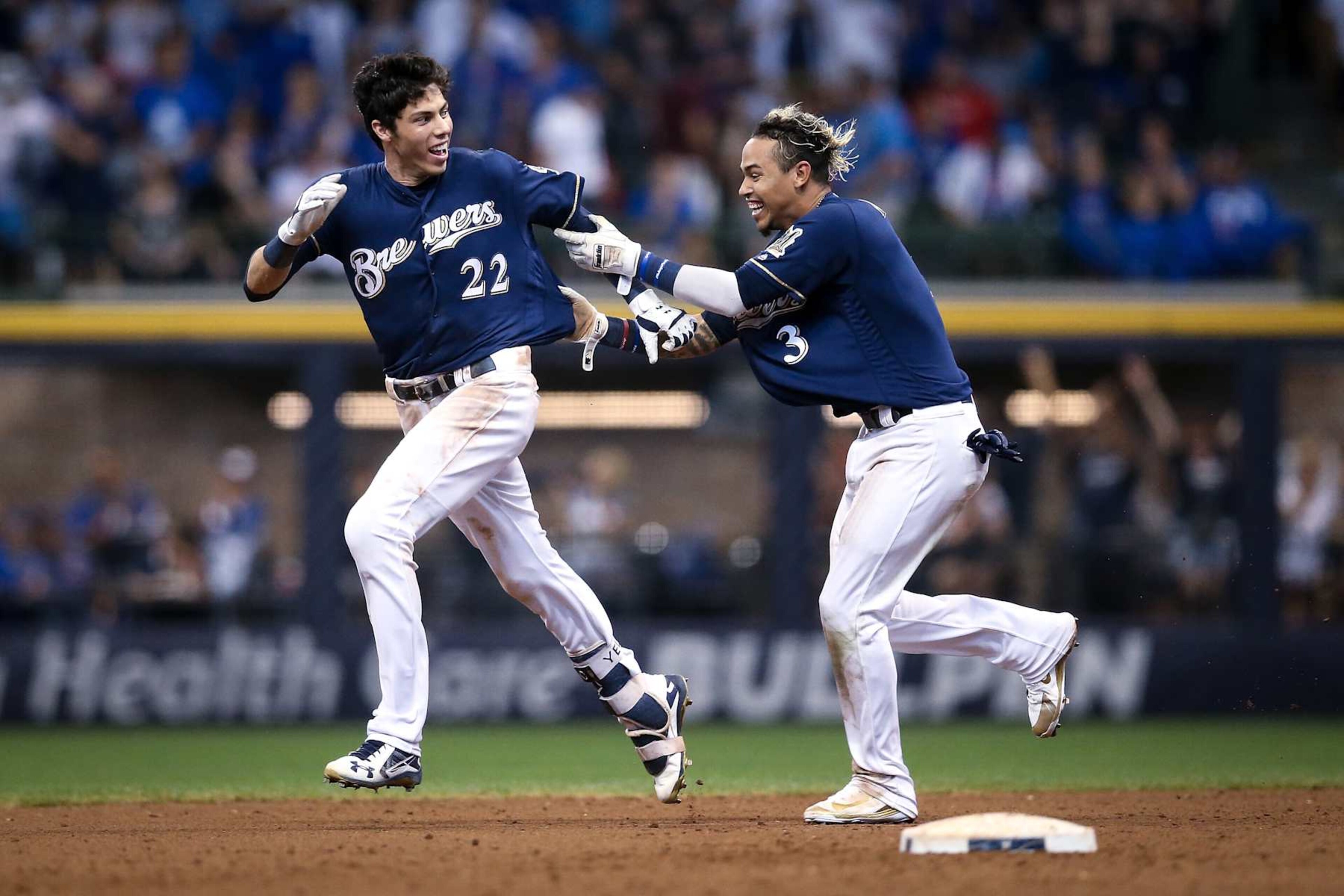 Christian Yelich (L) and Orlando Arcia (R) Christian Yelich (L) and Orlando Arcia (R)