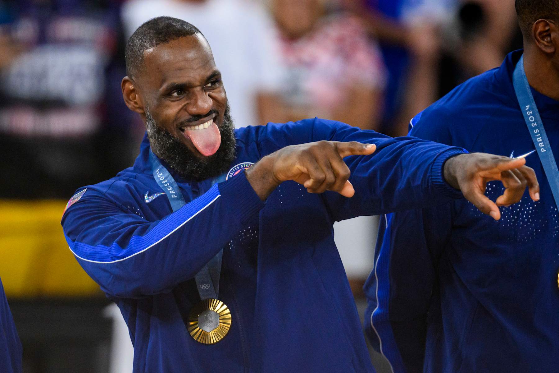 PARIS, FRANCE - AUGUST 11: Gold medalist LeBron James of Team United States celebrate on the podium during the Men's basketball medal ceremony on day fifteen of the Olympic Games Paris 2024 at the Bercy Arena on August 11, 2024 in Paris, France. (Photo by Tom Weller/VOIGT/GettyImages)