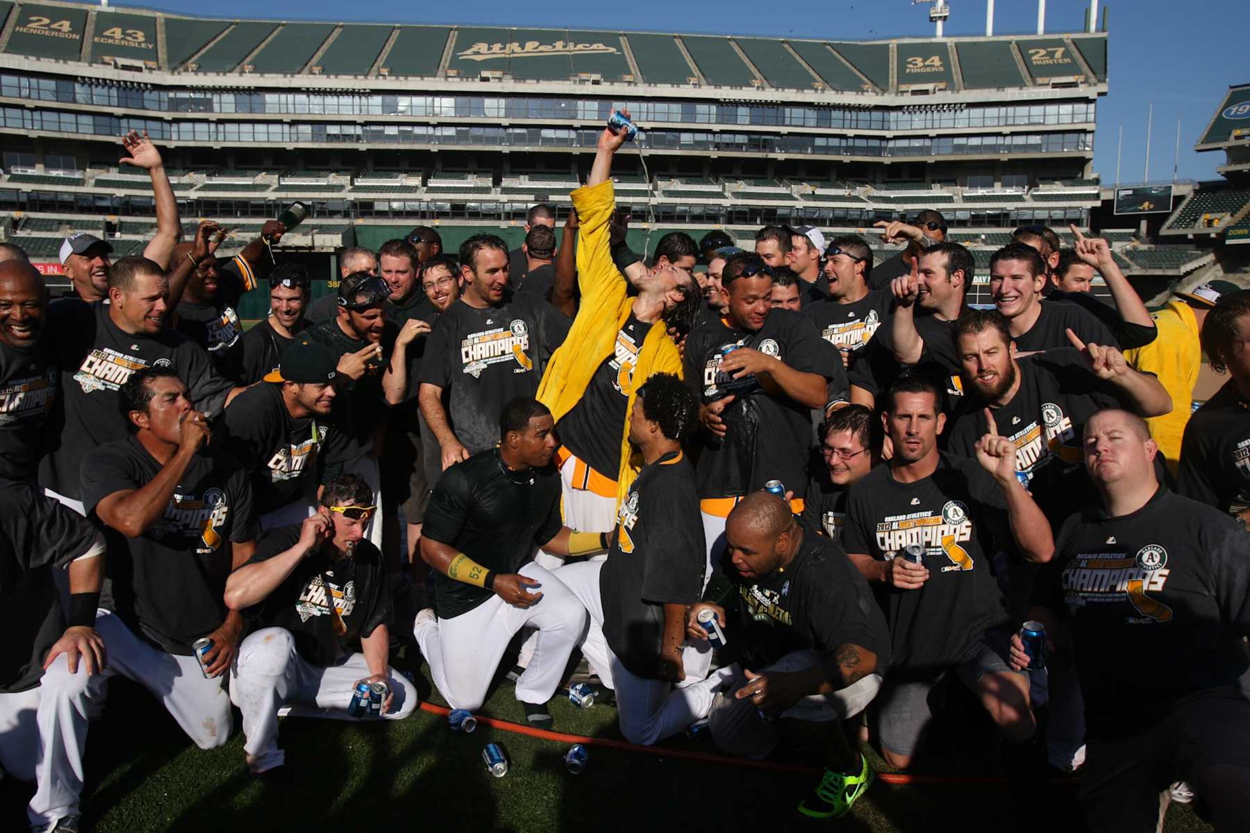 OAKLAND, CA - OCTOBER 3: Members of the Oakland Athletics celebrate and pose for photos on the pitchers mound after defeating the Texas Rangers to clinch the AL West Division title on Wednesday, October 3, 2012 at The Coliseum in Oakland, California. (Photo by Brad Mangin/MLB via Getty Images) OAKLAND, CA - OCTOBER 3: Members of the Oakland Athletics celebrate and pose for photos on the pitchers mound after defeating the Texas Rangers to clinch the AL West Division title on Wednesday, October 3, 2012 at The Coliseum in Oakland, California. (Photo by Brad Mangin/MLB via Getty Images)