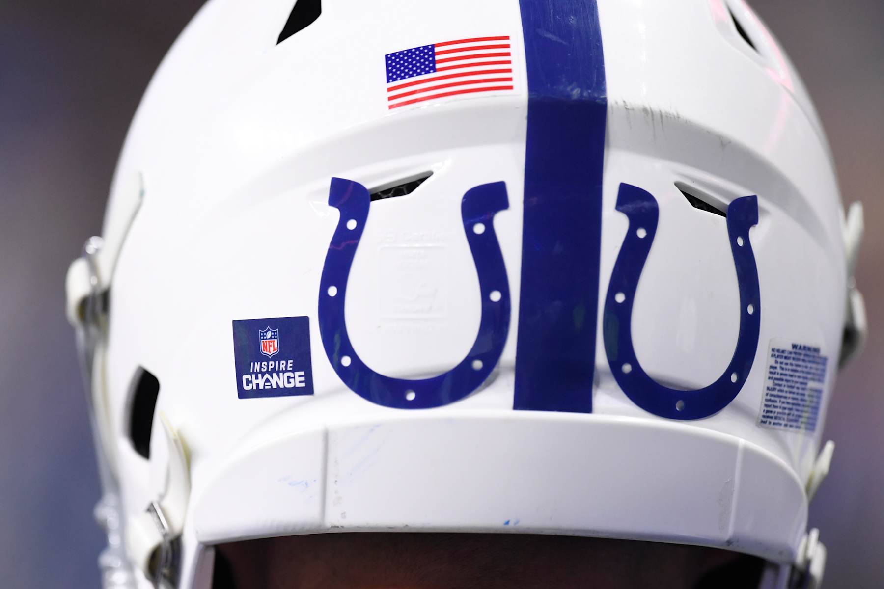 INDIANAPOLIS, IN - DECEMBER 16: An Inspire Change decal is seen beside Indianapolis Colts logos on the back of the helmet of a player during the NFL game between the Pittsburgh Steelers and the Indianapolis Colts on December 16, 2023, at Lucas Oil Stadium in Indianapolis, Indiana. (Photo by Michael Allio/Icon Sportswire via Getty Images)