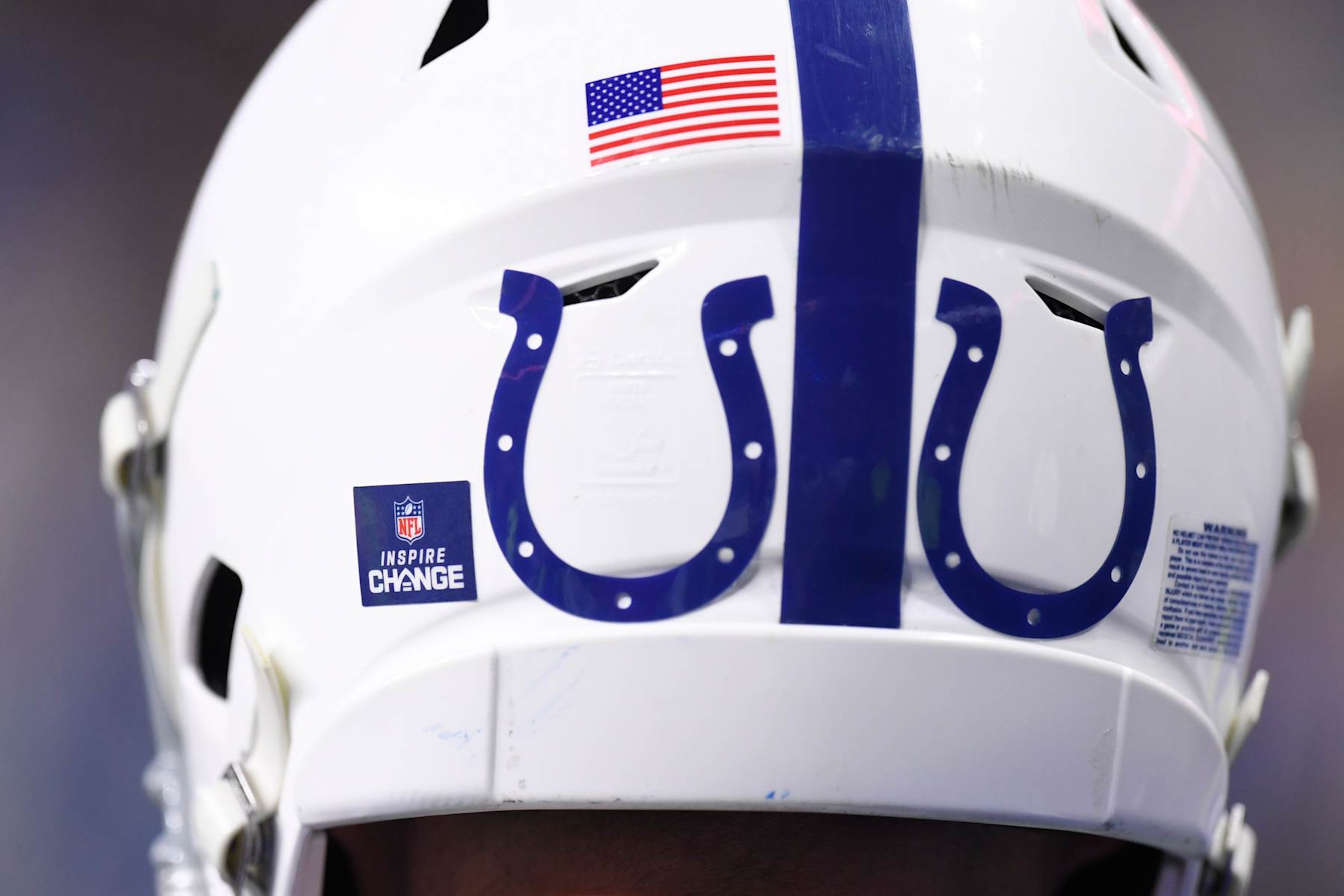 INDIANAPOLIS, IN - DECEMBER 16: An Inspire Change decal is seen beside Indianapolis Colts logos on the back of the helmet of a player during the NFL game between the Pittsburgh Steelers and the Indianapolis Colts on December 16, 2023, at Lucas Oil Stadium in Indianapolis, Indiana. (Photo by Michael Allio/Icon Sportswire via Getty Images)