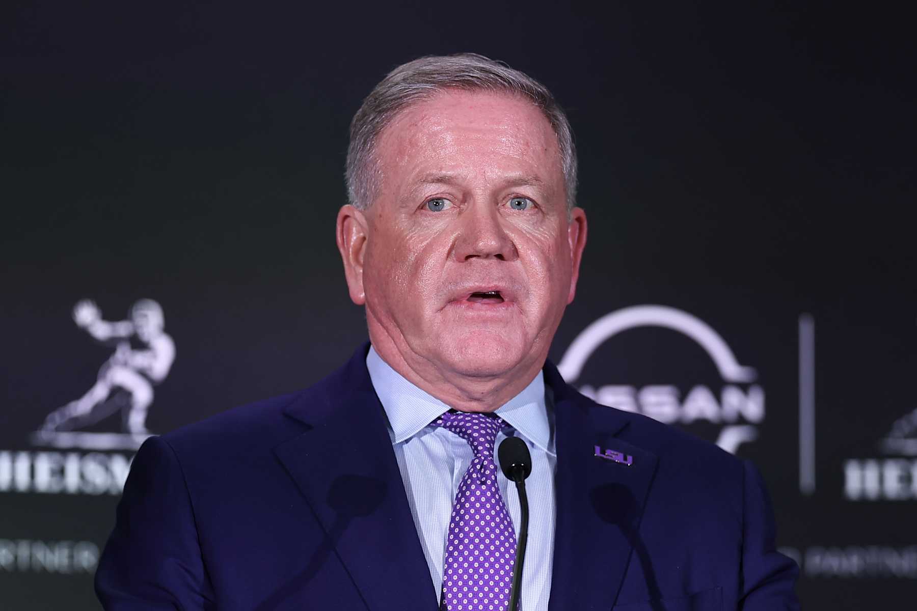 NEW YORK, NY - DECEMBER 09: Brian Kelly head football coach of LSU answers questions after winning the Heisman Trophy at a press conference at the New York Marriott Marquis on December 9, 2023 in New York City, New York.  (Photo by Rich Graessle/Icon Sportswire via Getty Images)