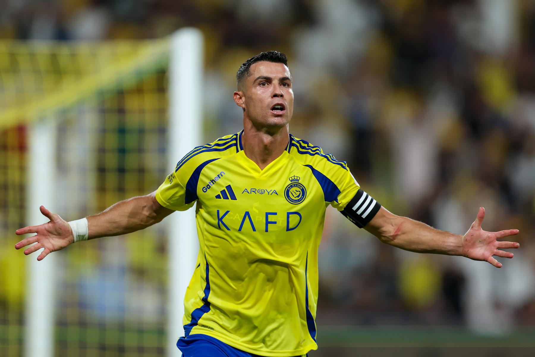 RIYADH, SAUDI ARABIA - AUGUST 22: Cristiano Ronaldo of Al Nassr celebrating after scores the 1st goal during the Saudi Pro League match between Al Nassr and Al Raed at Al Awwal Park Stadium on August 22, 2024 in Riyadh, Saudi Arabia. (Photo by Yasser Bakhsh/Getty Images)
