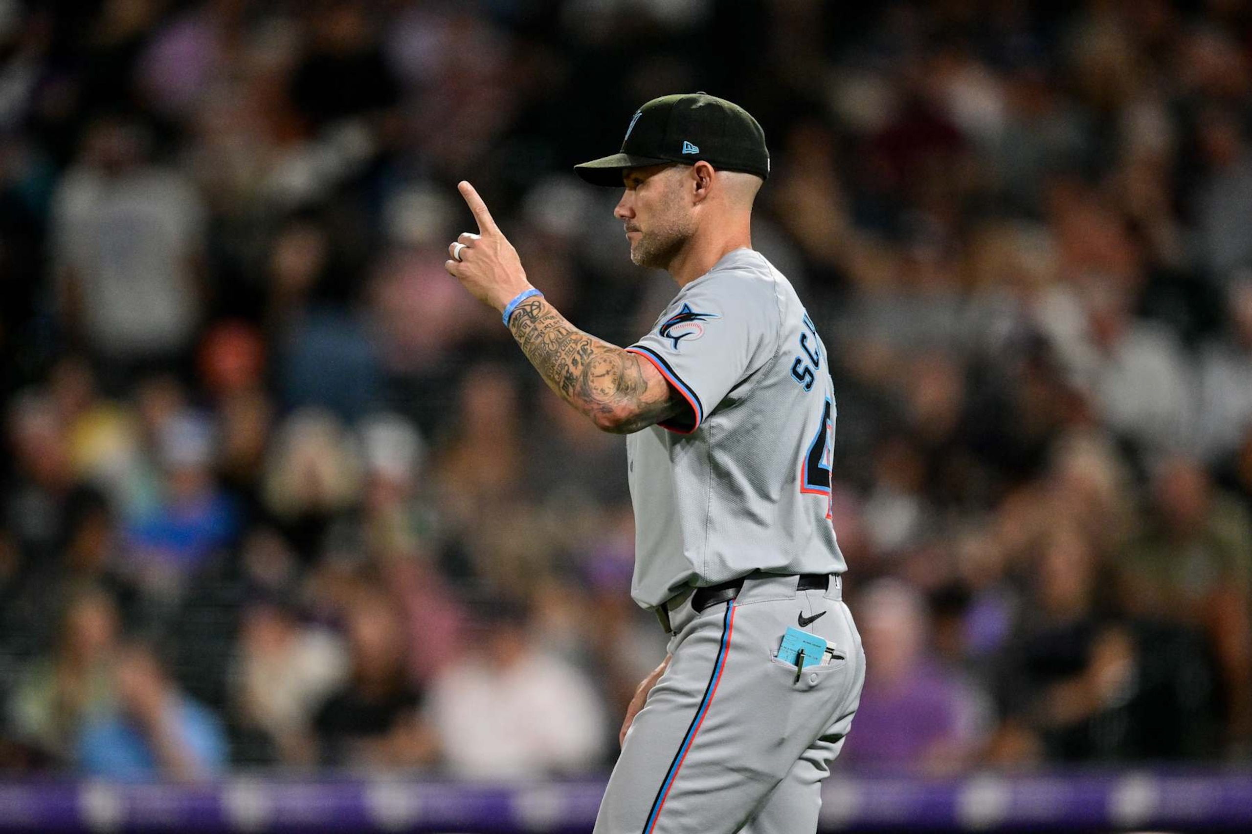 DENVER, COLORADO - AUGUST 26: Manager Skip Schumaker #45 of the Miami Marlins makes a pitching change in the sixth inning against the Colorado Rockies at Coors Field on August 26, 2024 in Denver, Colorado. (Photo by Dustin Bradford/Getty Images)