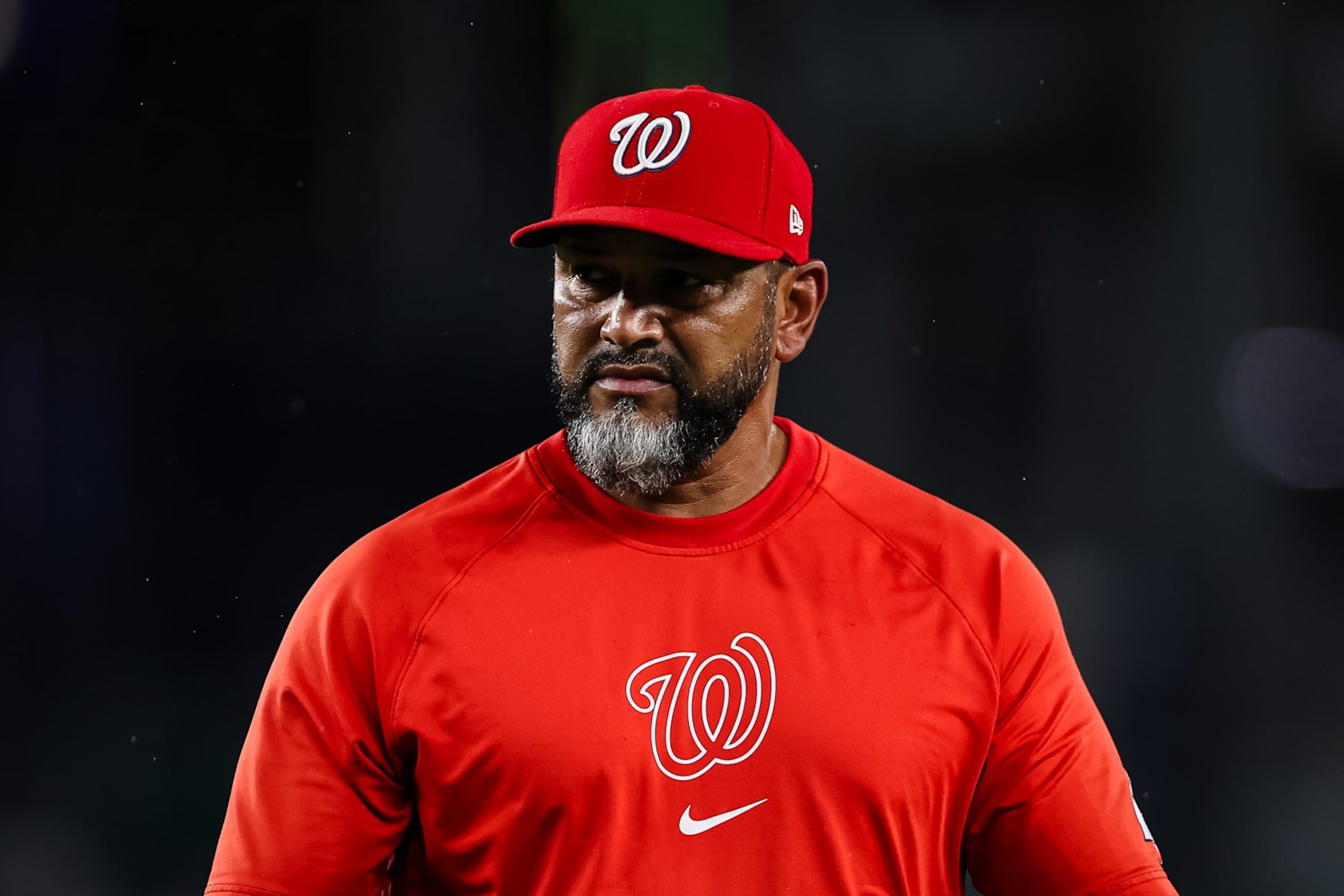 WASHINGTON, DC - JULY 23: Manager Dave Martinez #4 of the Washington Nationals looks on after making a pitching change during the eighth inning against the San Diego Padres at Nationals Park on July 23, 2024 in Washington, DC. (Photo by Scott Taetsch/Getty Images)