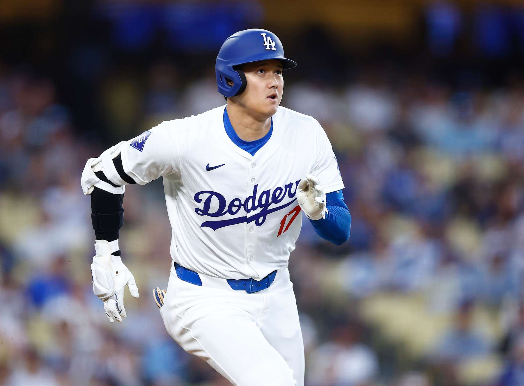 LOS ANGELES, CALIFORNIA - AUGUST 27:  Shohei Ohtani #17 of the Los Angeles Dodgers hits a single against the Baltimore Orioles in the first inning at Dodger Stadium on August 27, 2024 in Los Angeles, California.   (Photo by Ronald Martinez/Getty Images)