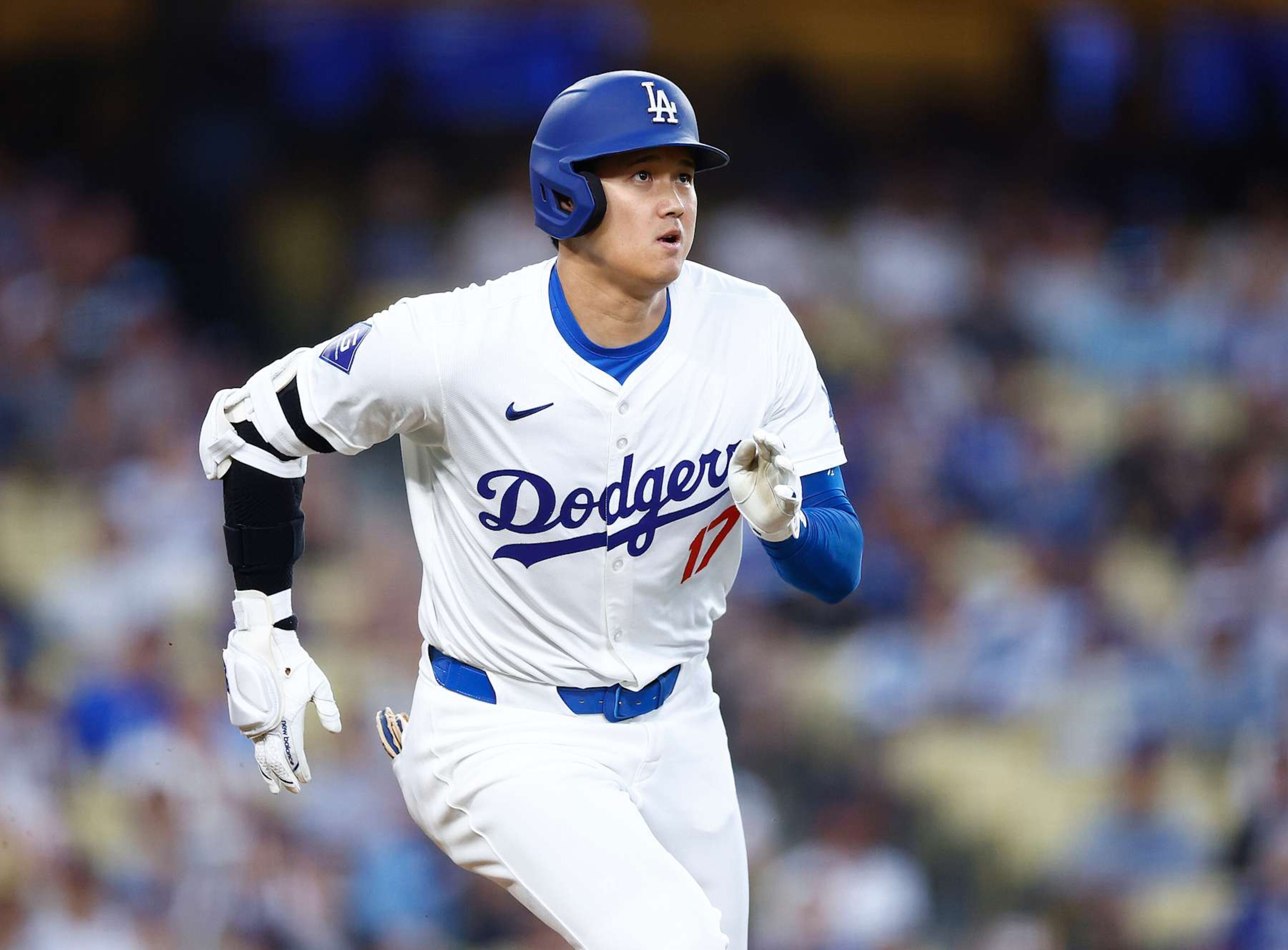 LOS ANGELES, CALIFORNIA - AUGUST 27:  Shohei Ohtani #17 of the Los Angeles Dodgers hits a single against the Baltimore Orioles in the first inning at Dodger Stadium on August 27, 2024 in Los Angeles, California.   (Photo by Ronald Martinez/Getty Images)