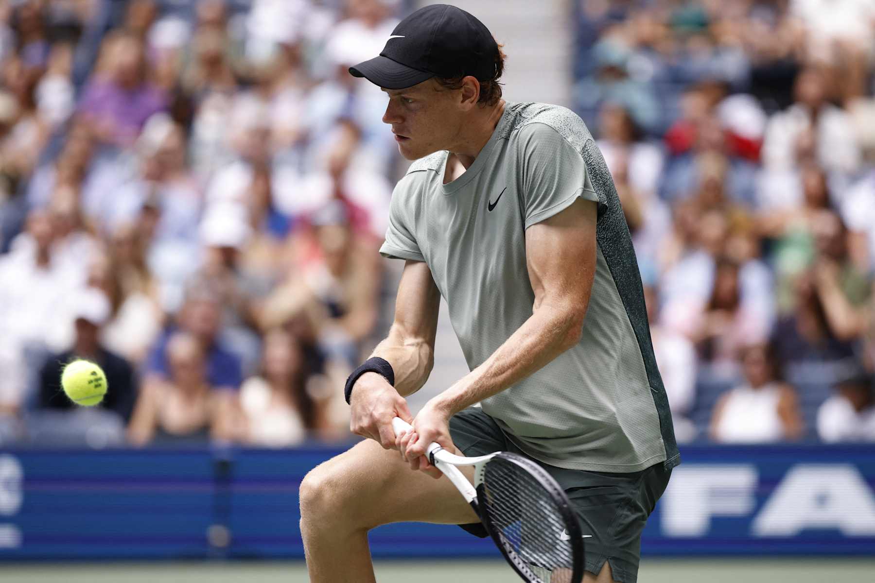 Italy's Jannik Sinner hits a return to Alex Michelsen of the US during their men's singles second round tennis match on day four of the US Open tennis tournament at the USTA Billie Jean King National Tennis Center in New York City, on August 29, 2024. (Photo by KENA BETANCUR / AFP) (Photo by KENA BETANCUR/AFP via Getty Images)