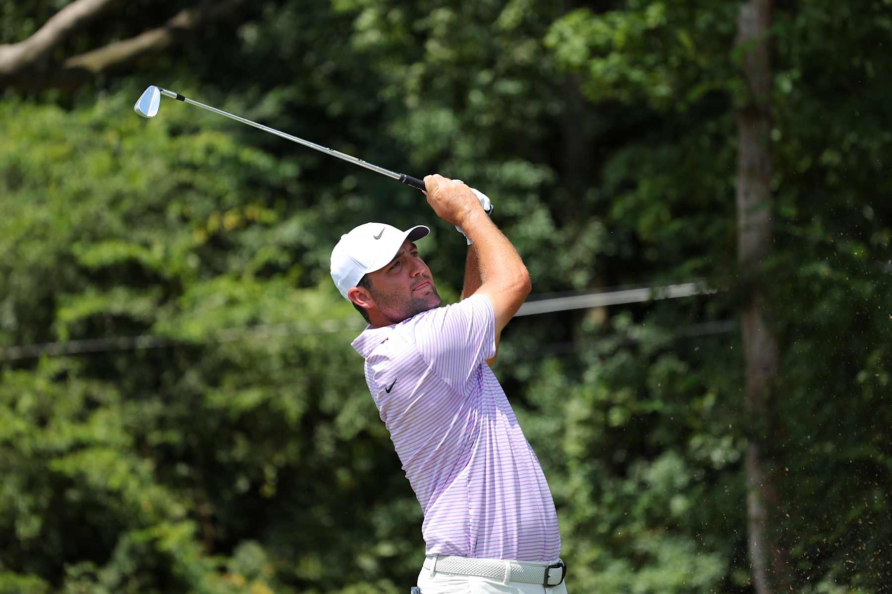 ATLANTA, GEORGIA - AUGUST 29: Scottie Scheffler of the United States hits his shot from the second tee during the first round of the TOUR Championship at East Lake Golf Club on August 29, 2024 in Atlanta, Georgia. (Photo by Kevin C. Cox/Getty Images)