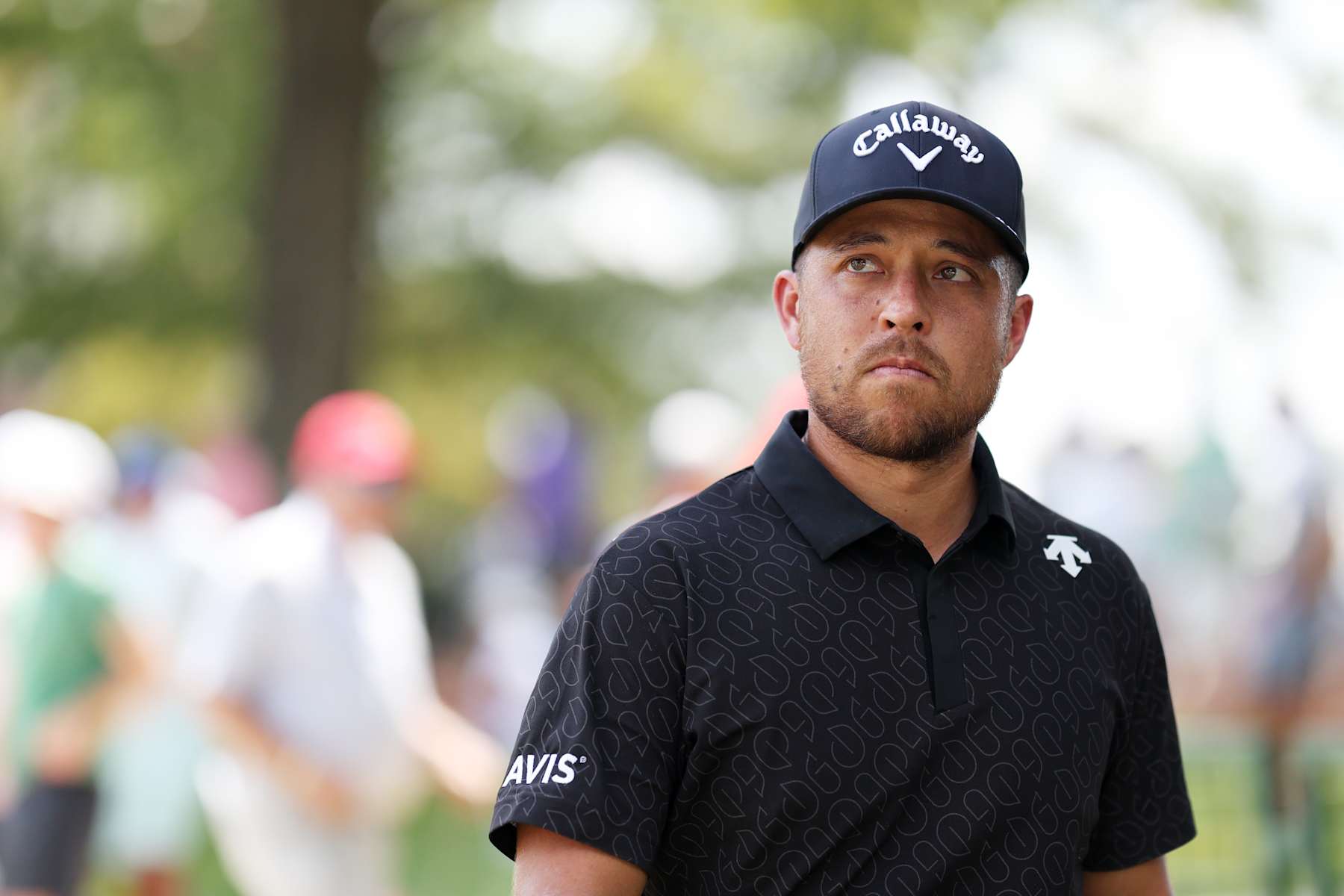 ATLANTA, GEORGIA - AUGUST 29: Xander Schauffele of the United States walks to the first tee during the first round of the TOUR Championship at East Lake Golf Club on August 29, 2024 in Atlanta, Georgia. (Photo by Mike Mulholland/Getty Images)