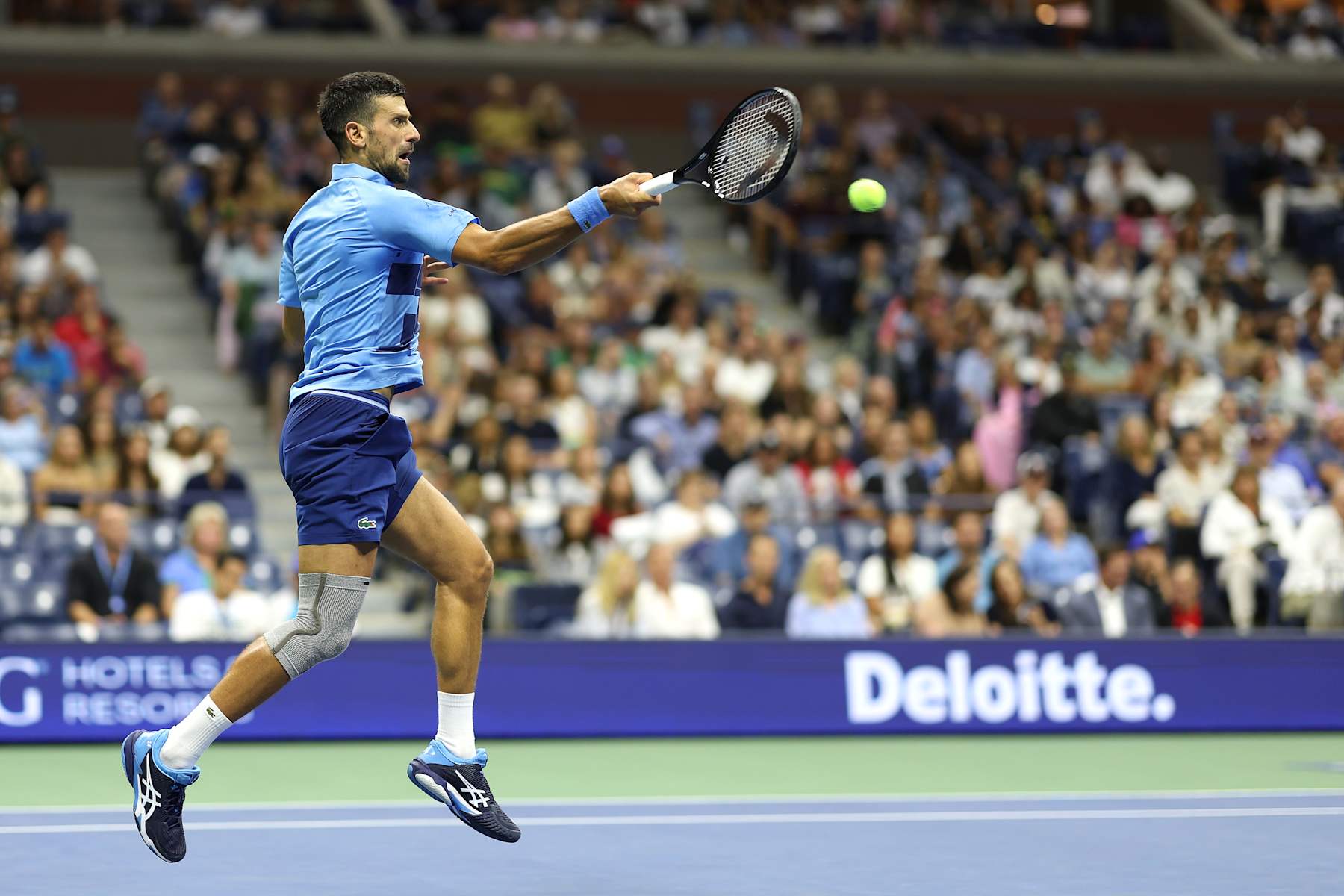NEW YORK, NEW YORK - AUGUST 30: Novak Djokovic of Serbia returns a shot against Alexei Popyrin of Australia during their Men's Singles Third Round match on Day Five of the 2024 US Open at USTA Billie Jean King National Tennis Center on August 30, 2024 in the Flushing neighborhood of the Queens borough of New York City. (Photo by Sarah Stier/Getty Images)