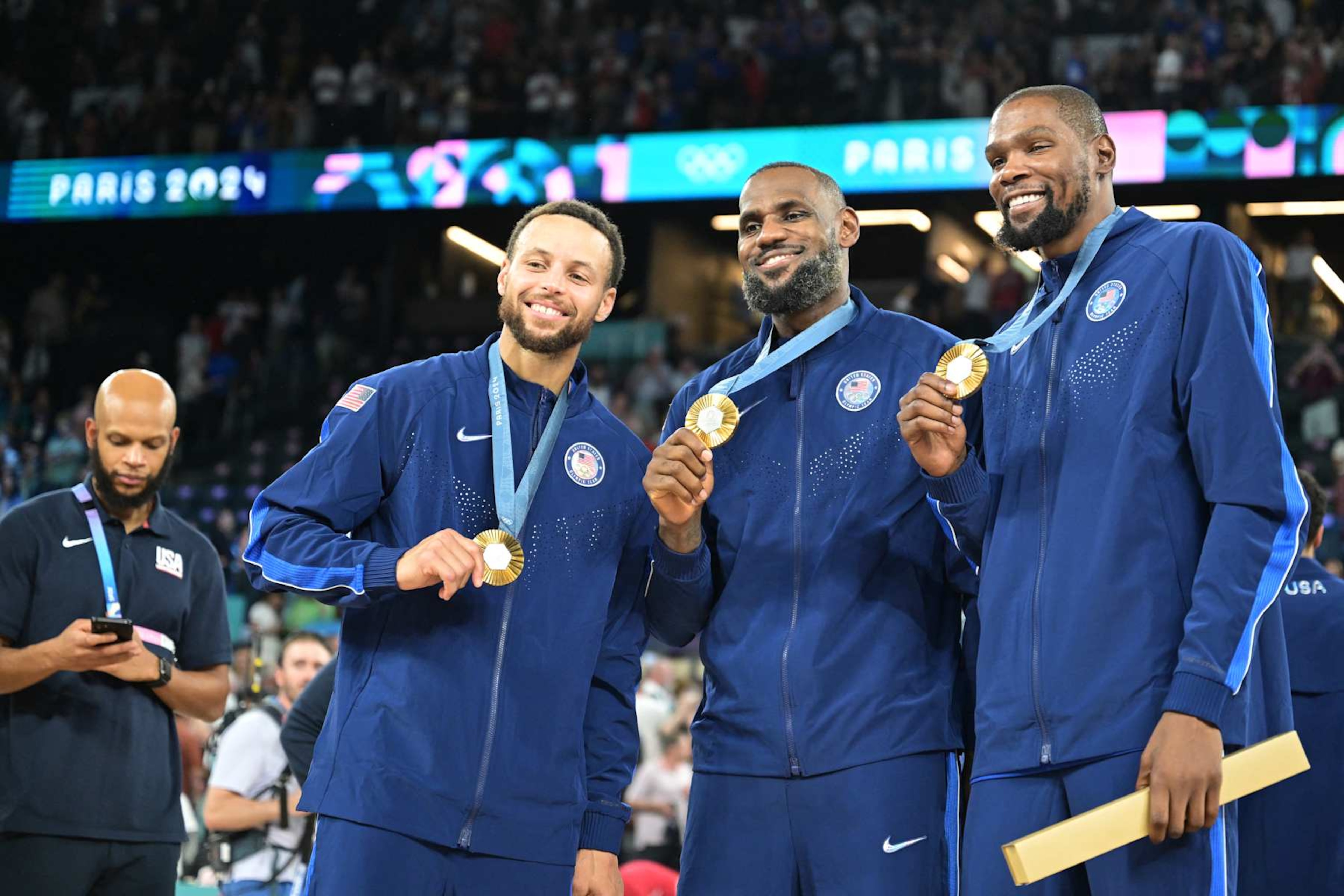 Gold medallists (From L) USA's #04 Stephen Curry, USA's #06 LeBron James and USA's #07 Kevin Durant pose after the men's Gold Medal basketball match between France and USA during the Paris 2024 Olympic Games at the Bercy Arena in Paris on August 10, 2024. (Photo by Damien MEYER / AFP) (Photo by DAMIEN MEYER/AFP via Getty Images) Gold medallists (From L) USA's #04 Stephen Curry, USA's #06 LeBron James and USA's #07 Kevin Durant pose after the men's Gold Medal basketball match between France and USA during the Paris 2024 Olympic Games at the Bercy Arena in Paris on August 10, 2024. (Photo by Damien MEYER / AFP) (Photo by DAMIEN MEYER/AFP via Getty Images)