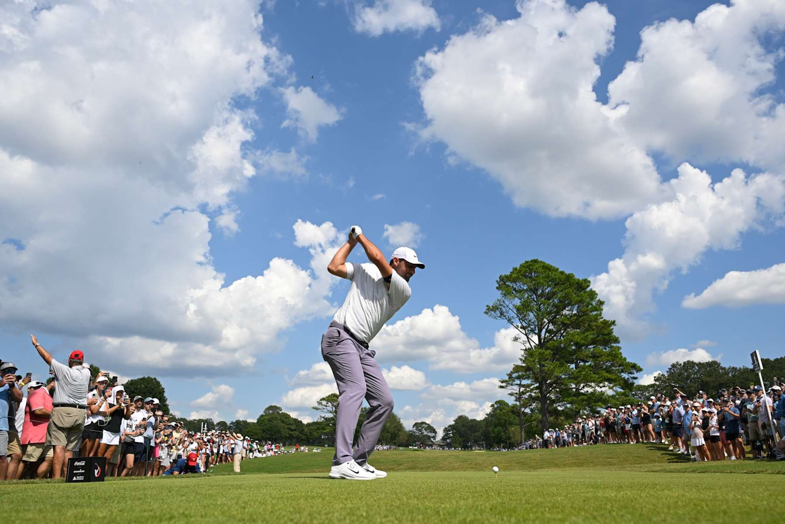 ATLANTA, GEORGIA - AUGUST 31: Scottie Scheffler of the United States hits a tee shot on the fourth hole during the third round of the TOUR Championship at East Lake Golf Club on August 31, 2024 in Atlanta, Georgia. (Photo by Ben Jared/PGA TOUR via Getty Images) ATLANTA, GEORGIA - AUGUST 31: Scottie Scheffler of the United States hits a tee shot on the fourth hole during the third round of the TOUR Championship at East Lake Golf Club on August 31, 2024 in Atlanta, Georgia. (Photo by Ben Jared/PGA TOUR via Getty Images)