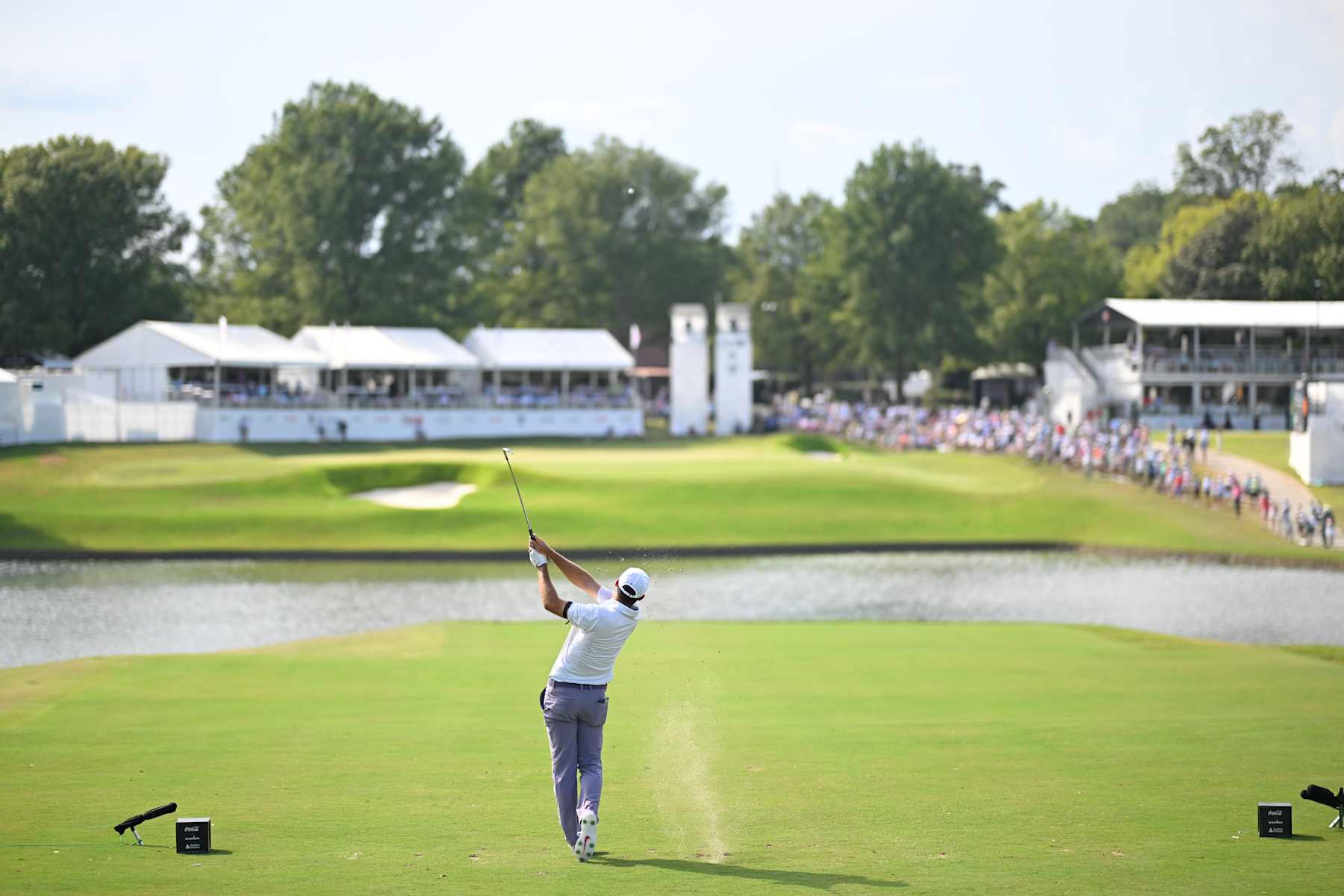 ATLANTA, GEORGIA - AUGUST 31: Scottie Scheffler of the United States hits a tee shot on the ninth hole during the third round of the TOUR Championship at East Lake Golf Club on August 31, 2024 in Atlanta, Georgia. (Photo by Ben Jared/PGA TOUR via Getty Images)