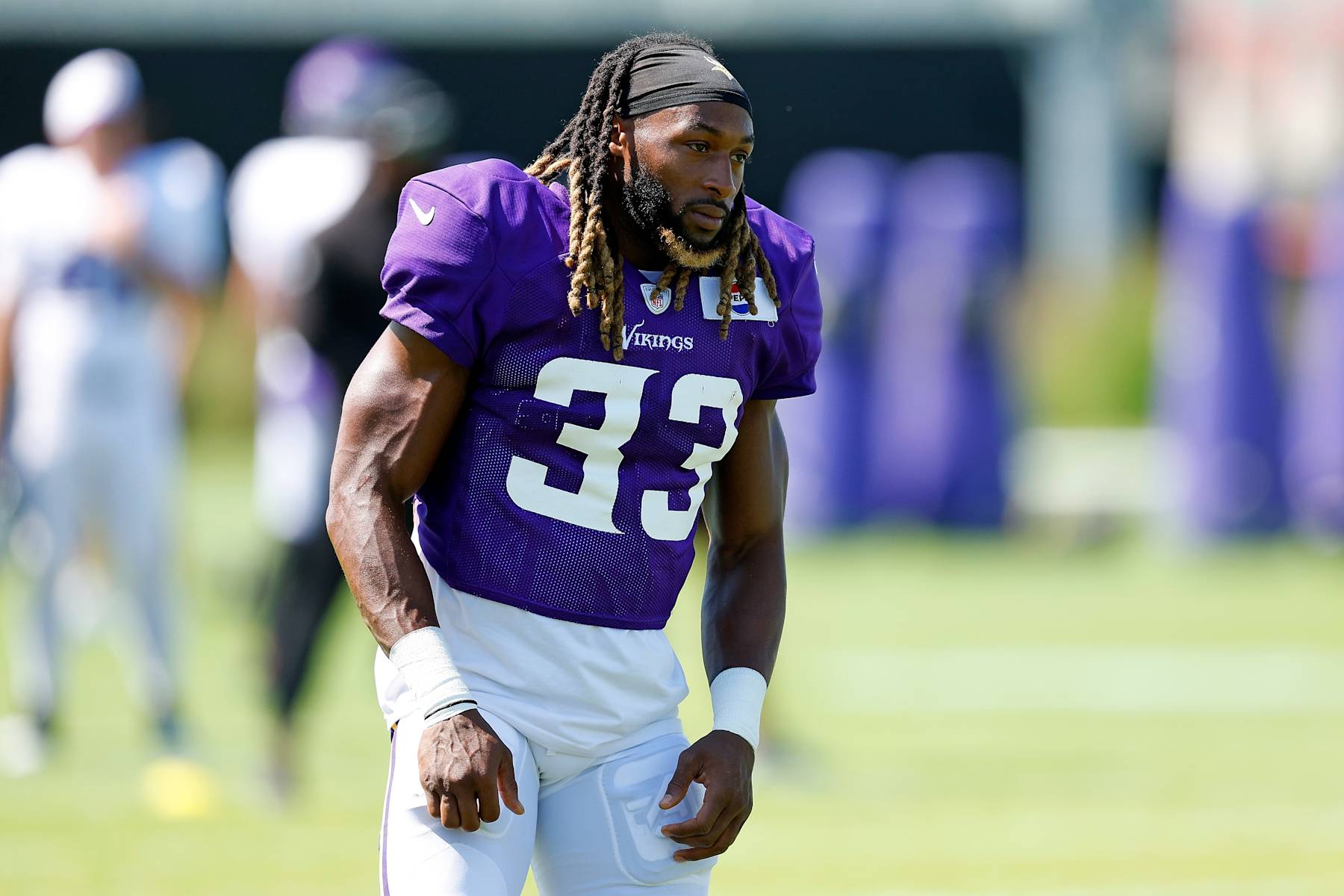 EAGAN, MINNESOTA - AUGUST 02: Aaron Jones #33 of the Minnesota Vikings looks on during training camp on August 02, 2024 in Eagan, Minnesota. (Photo by David Berding/Getty Images)