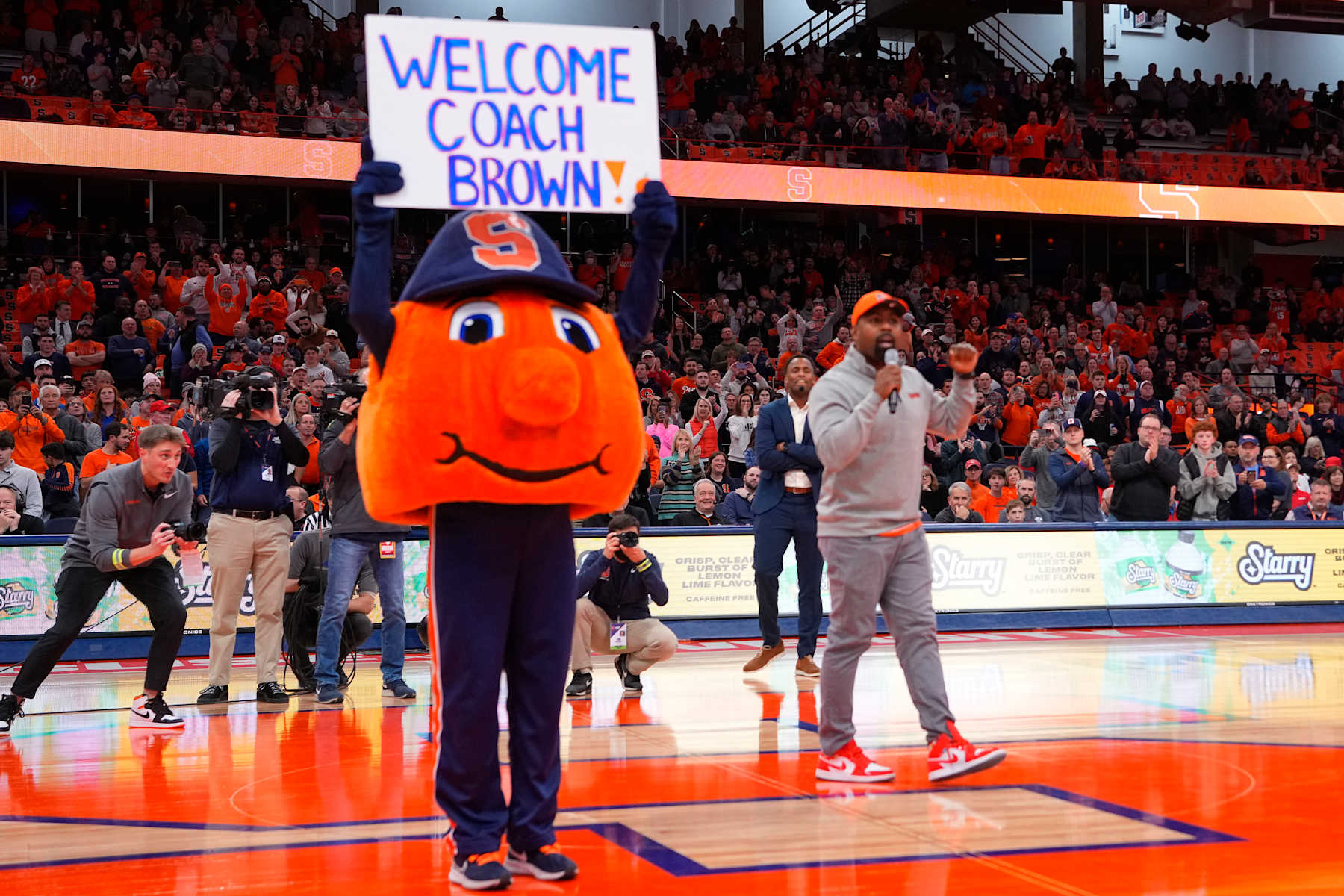 SYRACUSE, NY - DECEMBER 05: New Syracuse Football Head Coach Fran Brown is introduced to the Syracuse crowd at a break during the first half of the College Basketball game between the Cornell Big Red and the Syracuse Orange on December 5, 2023, at the JMA Wireless Dome in Syracuse, NY. (Photo by Gregory Fisher/Icon Sportswire via Getty Images)