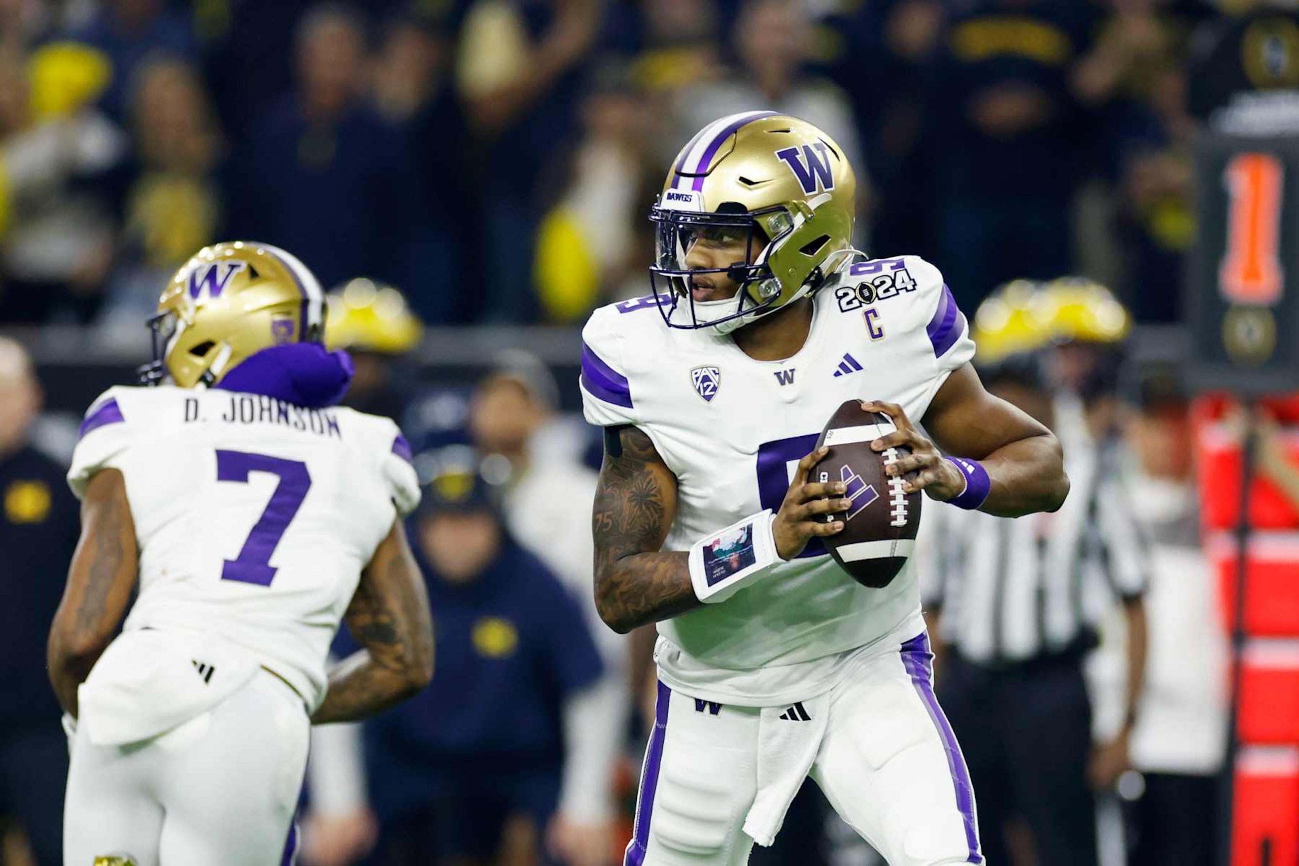 HOUSTON, TX - JANUARY 08: Washington Huskies quarterback Michael Penix Jr. (9) looks to pass the ball during the CFP National Championship against the Michigan Wolverines on January 08, 2024 at NRG Stadium in Houston, Texas. (Photo by Joe Robbins/Icon Sportswire via Getty Images) HOUSTON, TX - JANUARY 08: Washington Huskies quarterback Michael Penix Jr. (9) looks to pass the ball during the CFP National Championship against the Michigan Wolverines on January 08, 2024 at NRG Stadium in Houston, Texas. (Photo by Joe Robbins/Icon Sportswire via Getty Images)