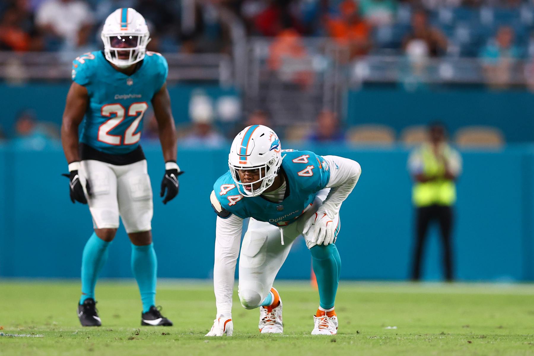 MIAMI GARDENS, FLORIDA - AUGUST 17: Chop Robinson #44 of the Miami Dolphins looks on against the Washington Commanders during the second quarter of a preseason game at Hard Rock Stadium on August 17, 2024 in Miami Gardens, Florida. (Photo by Megan Briggs/Getty Images)