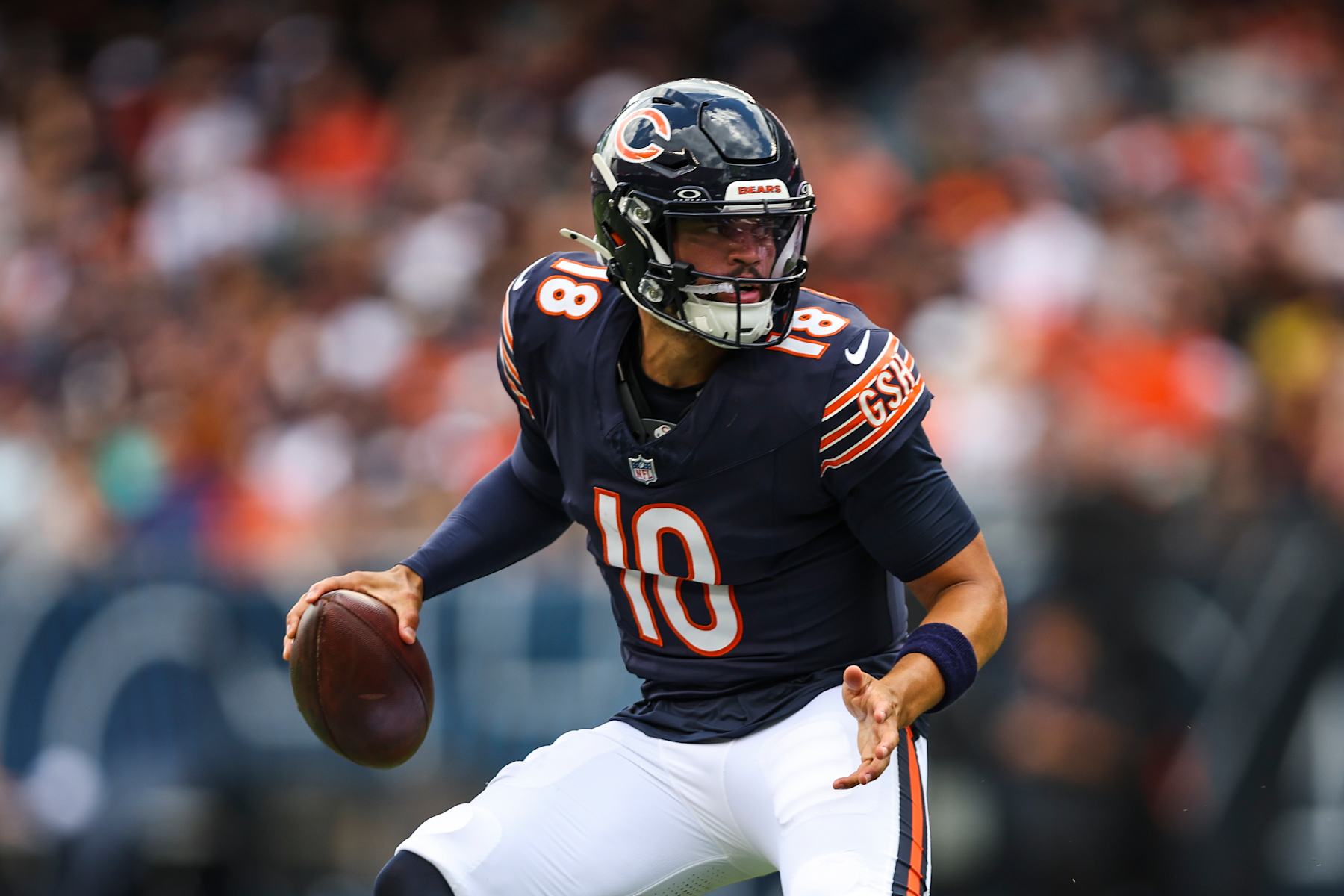CHICAGO, IL - AUGUST 17: Caleb Williams #18 of the Chicago Bears drops back to pass during an NFL football game against the Cincinnati Bengals at Solider Field on August 17, 2024 in Chicago, Illinois. (Photo by Perry Knotts/Getty Images)