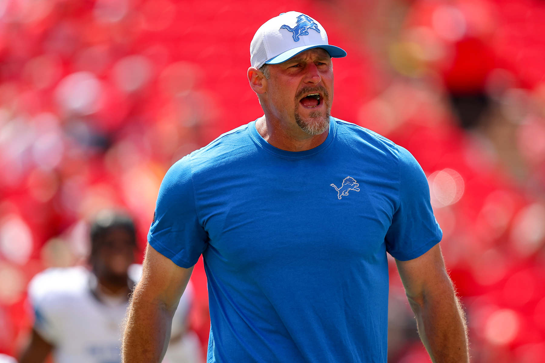 KANSAS CITY, MISSOURI - AUGUST 17: Detroit Lions head coach Dan Campbell greets players during pregame warmups prior to the preseason game against the Kansas City Chiefs at GEHA Field at Arrowhead Stadium on August 17, 2024 in Kansas City, Missouri. (Photo by David Eulitt/Getty Images)