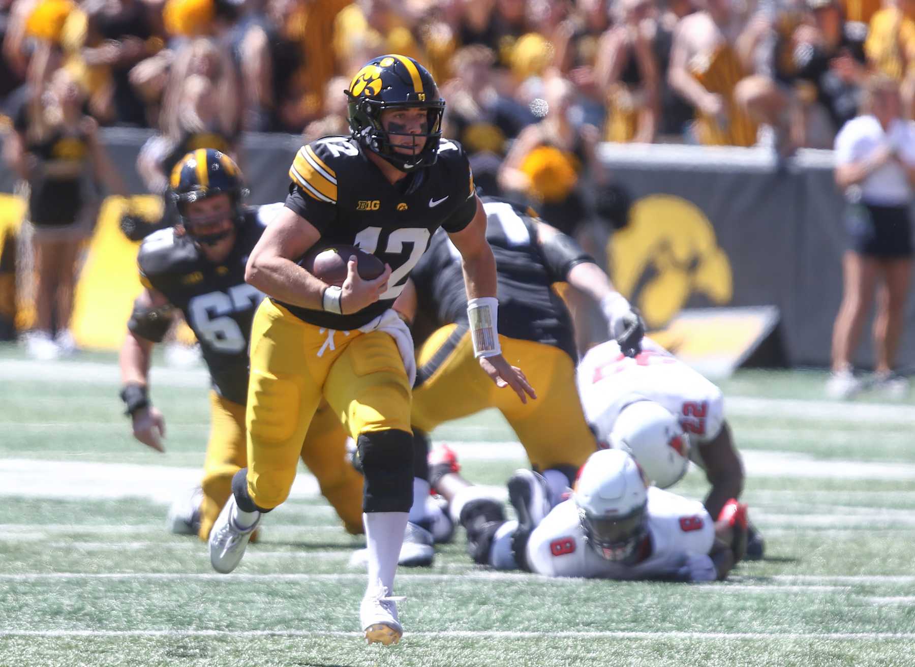 IOWA CITY, IOWA- AUGUST 31:  Quarterback Cade McNamara #12 of the Iowa Hawkeyes  scrambles on a keeper during the first half against the Illinois State Redbirds at Kinnick Stadium on August 31, 2024 in Iowa City, Iowa.  (Photo by Matthew Holst/Getty Images)