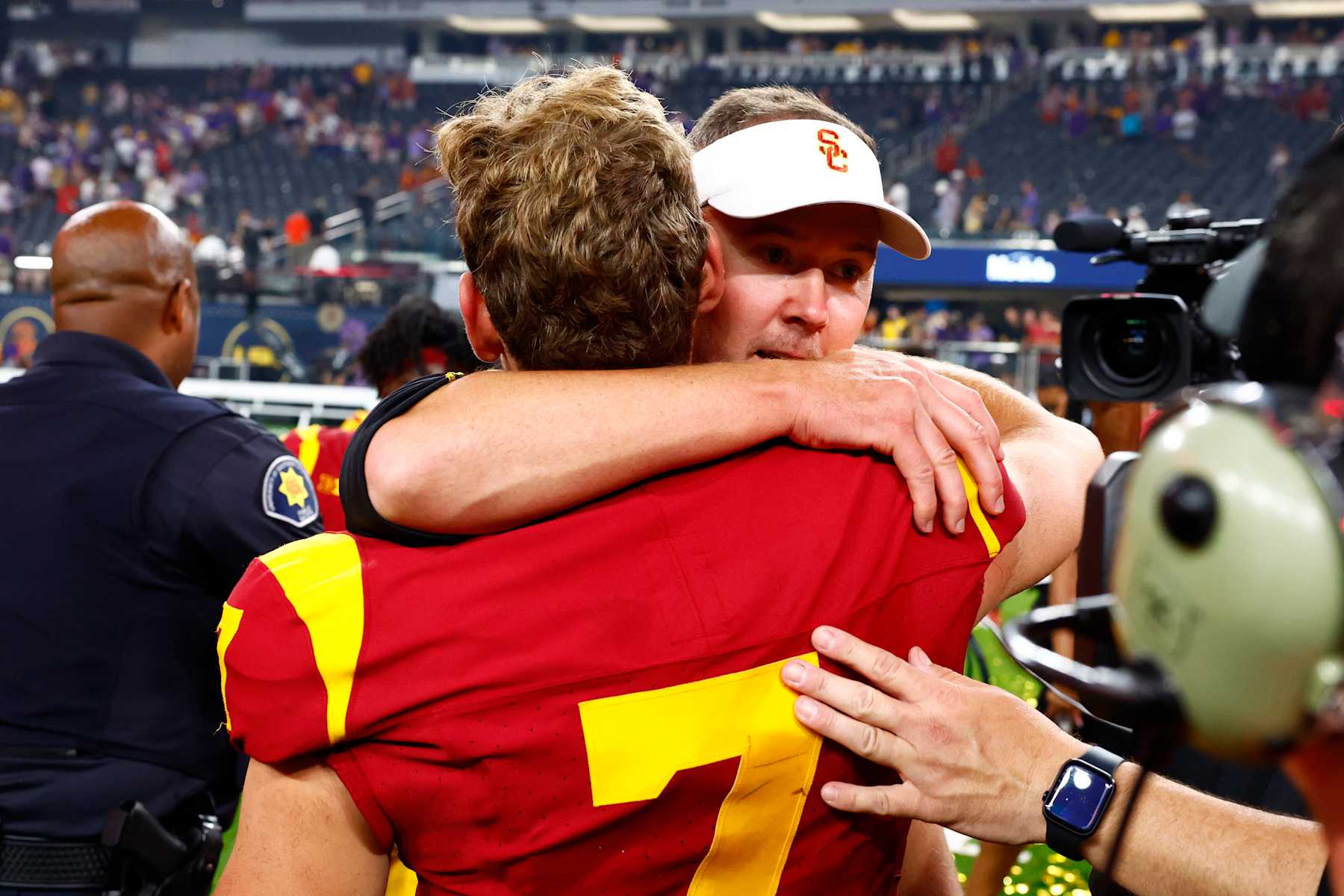 LAS VEGAS, NV - SEPTEMBER 01: Head coach Lincoln Riley of the USC Trojans hugs quarterback Miller Moss (7) after winning the Modelo Vegas Kickoff Classic featuring the USC Trojans versus the LSU Tigers on September 1, 2024 at Allegiant Stadium in Las Vegas, Nevada. (Photo by Jeff Speer/Icon Sportswire via Getty Images)