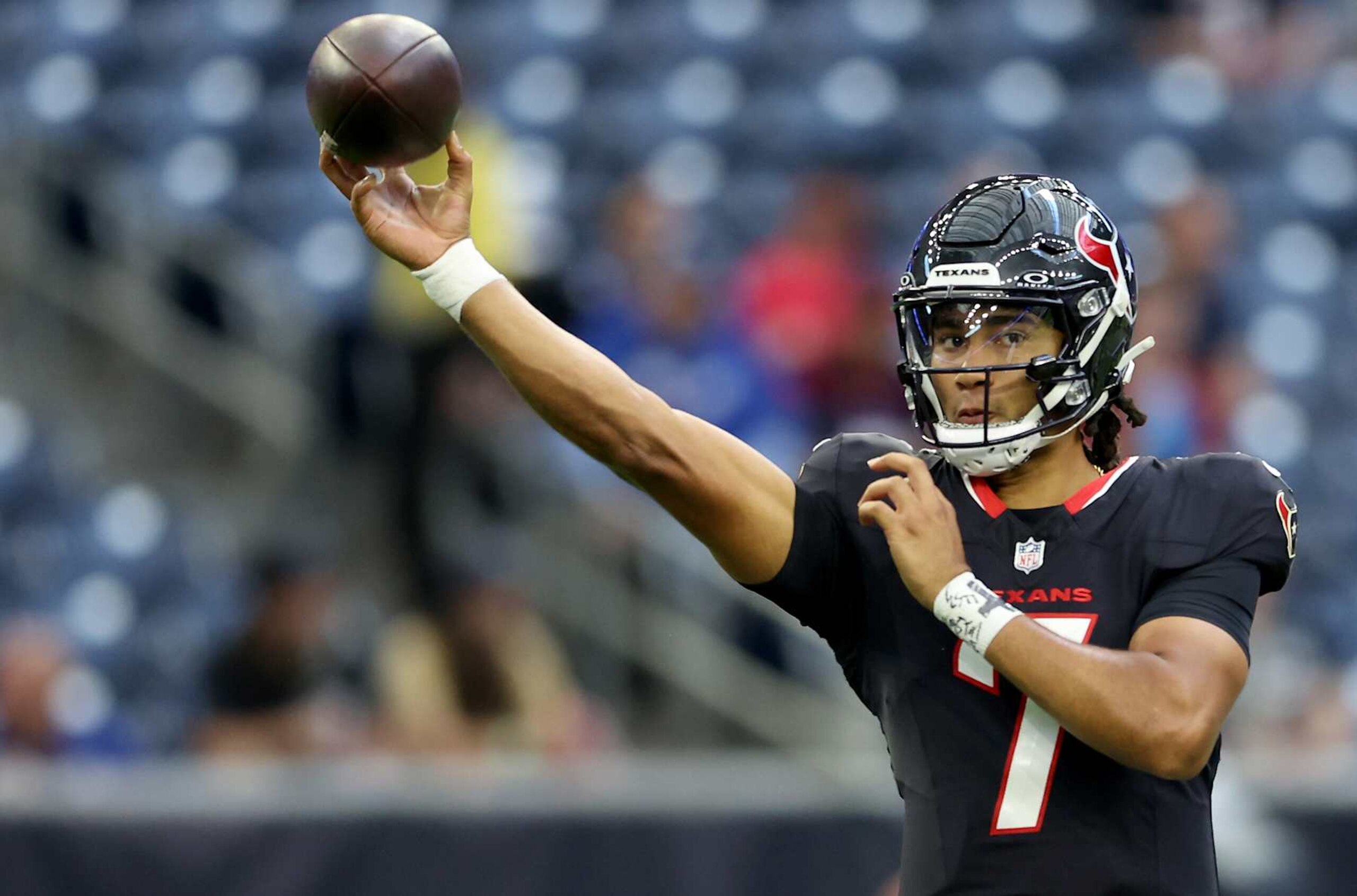 HOUSTON, TEXAS - AUGUST 17: C.J. Stroud #7 of the Houston Texans throws a pass before the preseason game against the New York Giants at NRG Stadium on August 17, 2024 in Houston, Texas. (Photo by Tim Warner/Getty Images)