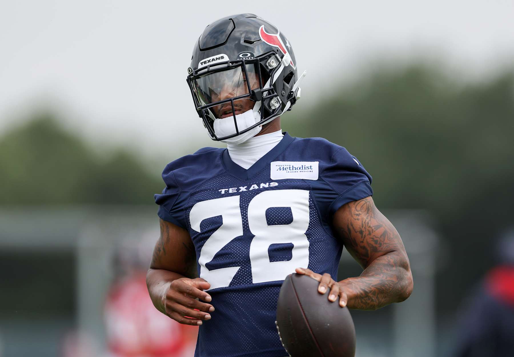 HOUSTON, TEXAS - JUNE 04: Joe Mixon #28 of the Houston Texans runs the ball during Mandatory Minicamp at Houston Methodist Training Center on June 04, 2024 in Houston, Texas. (Photo by Tim Warner/Getty Images)