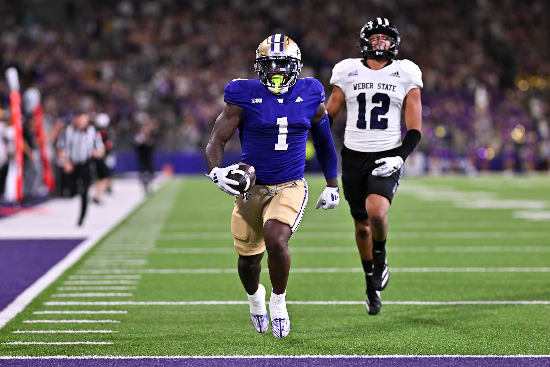 SEATTLE, WASHINGTON - AUGUST 31: Jonah Coleman #1 of the Washington Huskies runs with the ball during the first quarter of the game against the Weber State Wildcats at Husky Stadium on August 31, 2024 in Seattle, Washington. (Photo by Alika Jenner/Getty Images)
