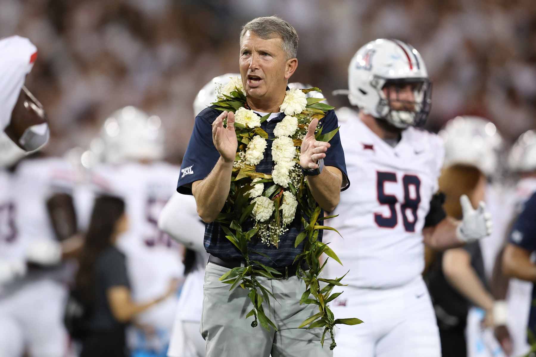 TUCSON, ARIZONA - AUGUST 31: Head coach Brent Brennan of the Arizona Wildcats applauds during warm ups before the game against the New Mexico Lobos at Arizona Stadium on August 31, 2024 in Tucson, Arizona.  (Photo by Chris Coduto/Getty Images)