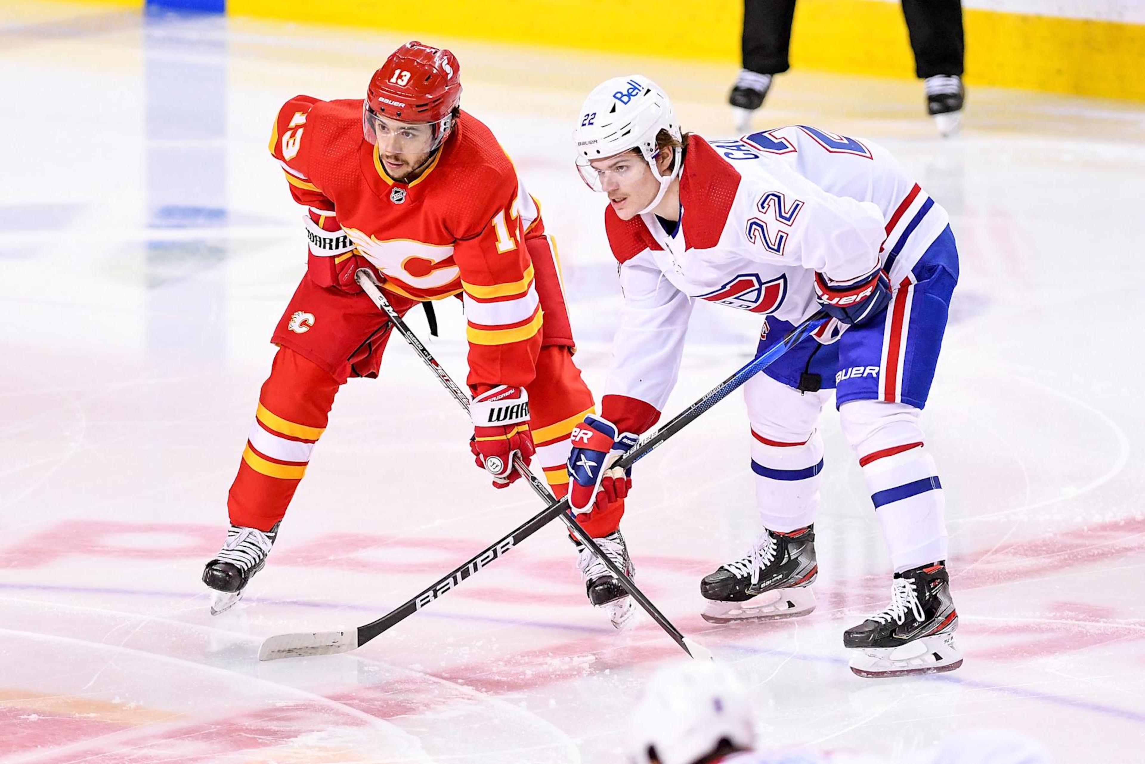 CALGARY, AB - APRIL 26: Calgary Flames Left Wing Johnny Gaudreau (13) and Montreal Canadiens Right Wing Cole Caufield (22) get set for a face-off during the first period of an NHL game where the Calgary Flames hosted the Montreal Canadiens on April 26, 2021, at the Scotiabank Saddledome in Calgary, AB. (Photo by Brett Holmes/Icon Sportswire via Getty Images) CALGARY, AB - APRIL 26: Calgary Flames Left Wing Johnny Gaudreau (13) and Montreal Canadiens Right Wing Cole Caufield (22) get set for a face-off during the first period of an NHL game where the Calgary Flames hosted the Montreal Canadiens on April 26, 2021, at the Scotiabank Saddledome in Calgary, AB. (Photo by Brett Holmes/Icon Sportswire via Getty Images)