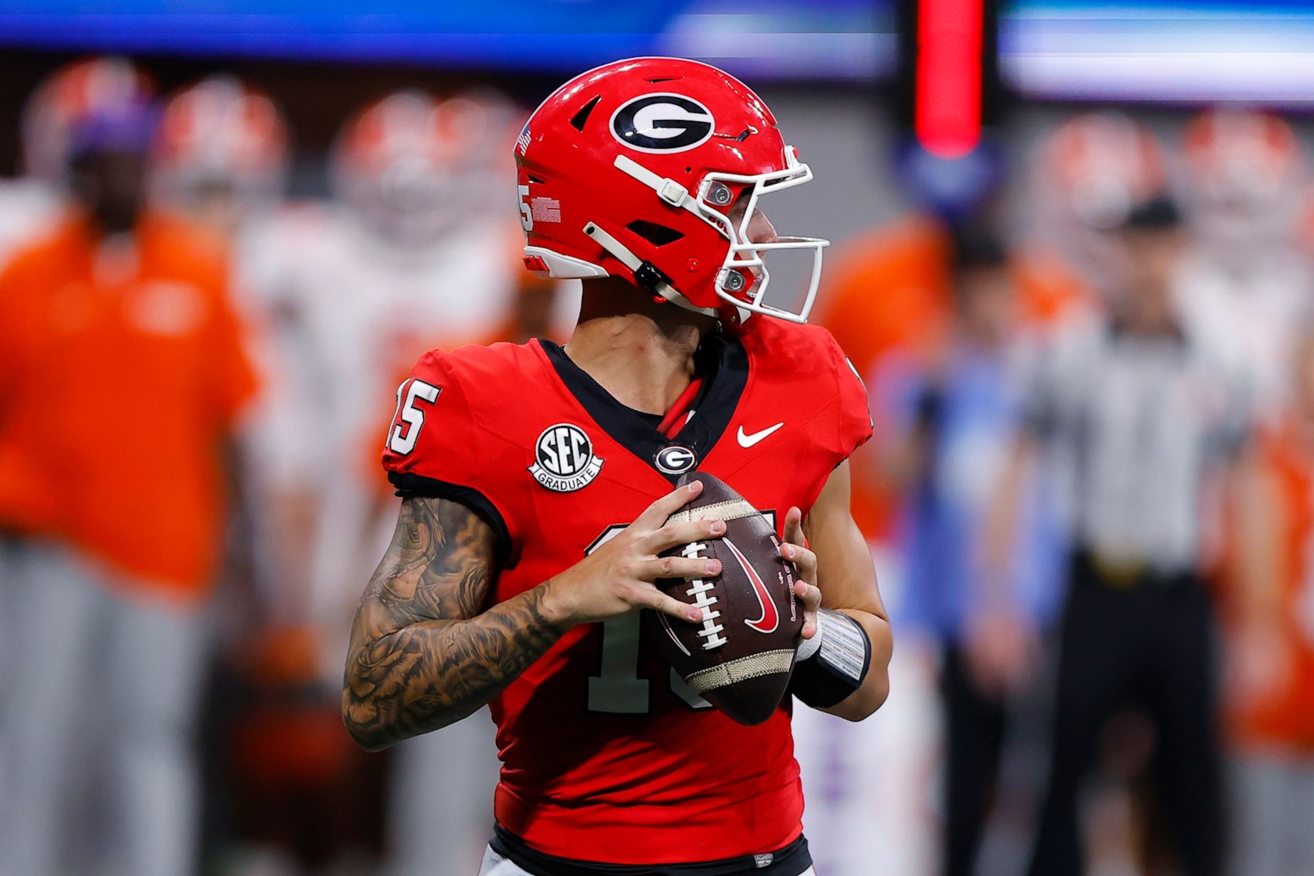 ATHENS, GEORGIA - AUGUST 31: Carson Beck #15 of the Georgia Bulldogs drops back to pass during the third quarter against the Clemson Tigers in the Aflac Kickoff Game at Mercedes-Benz Stadium on August 31, 2024 in Atlanta, Georgia.  (Photo by Todd Kirkland/Getty Images)